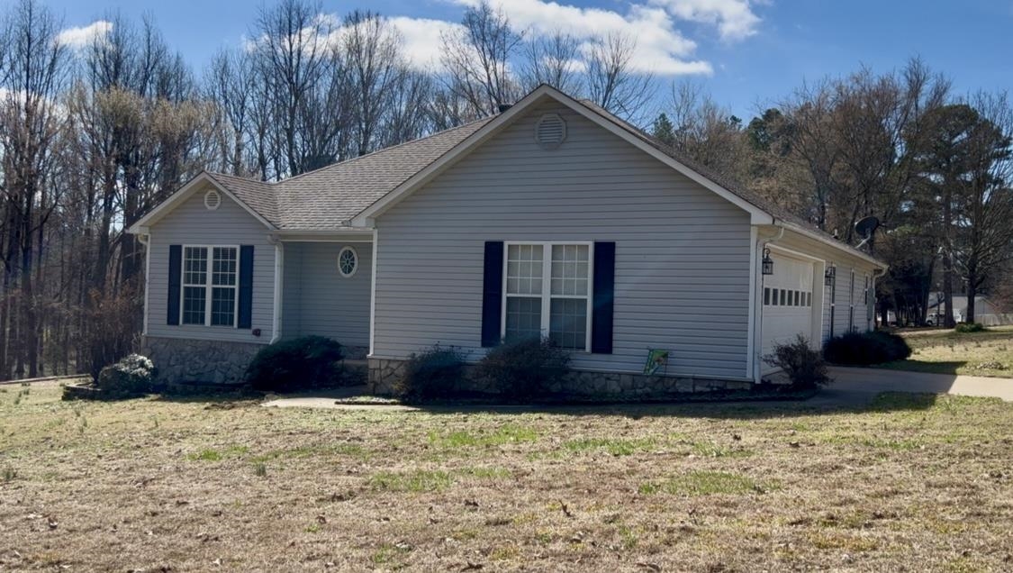 This well maintained all electric home has 3 Bedrooms, 2 bathrooms with 1,582 Sqft and sits on a corner lot totaling 1 acre. The living room has vaulted ceilings and a fireplace. The kitchen has plenty of space and cabinets. Recent updates include fresh paint throughout and new carpets in the bedrooms in 2023. Roof replaced in 2019. Septic Tank pumped March 2025 (10X20) Outbuilding and good sized wood deck. Call to set a showing today.