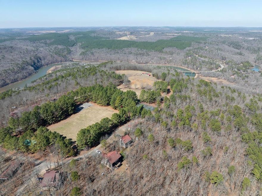 Camp Bear Track is a unique opportunity to purchase an established youth camp and retreat facility in north central Arkansas. Approx. 160 wooded acres with about 600 feet of Corps of Engineers lake frontage. Improvements include 25+ buildings, a 10,000 sq ft lodge with commercial kitchen and dining hall, cabins, offices, chapel, pool, sports fields, climbing tower, high ropes course, maintenance buildings, and extensive outdoor recreation areas. Designed for 125+ campers, the property is well suited for camp, retreat, ministry, educational, or outdoor program use. To be sold furnished with most equipment included, excluding personal items. Owners may remain available for a transition period. Rare turn-key investment opportunity.  Shown by appointment only. No exceptions. ABSOLUTELY NO TRESPASSING - DO NOT enter the property without a licensed agent present.