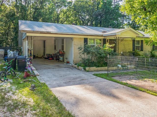 MOTIVATED SELLER, BRING ALL OFFERS! Seller to provide concession for repairs with acceptable offer. Beautiful two bedroom, two full bathroom home on a large lot, formal living room, kitchen with electric range, oven and microwave, large den, basement, covered patio, detached garage workshop and storage building. It won't last long!!