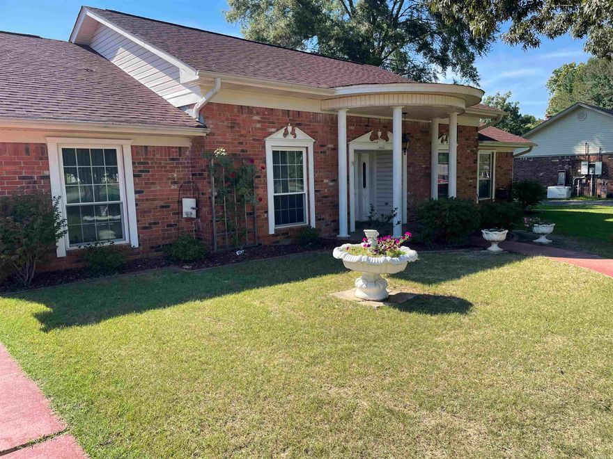 Incredible home in an ideal neighborhood.  Come take a look.  You will notice the charm immediately as you pull into the driveway and see how beautiful the home is.  The two car carport, the single car garage will attract you, the gorgeous lawn will draw you in, the home's exterior detail will keep you staring, and the front porch will say "come on in".   So many special things about this home because it was custom built.  The 4th bedroom is separate from other three and is used as an office now.  The upstairs two rooms are unfinished attic space.   The shop in the back is 24'x40' and has an upstairs.  To appreciate the beauty of this unique home, you should come take a look.  The warm feeling in the den/family room with the wood on the walls will have you wanting to sit and relax a while.  The quality in this house stands out.    Owner is selling as is. Time to go see is NOW!!