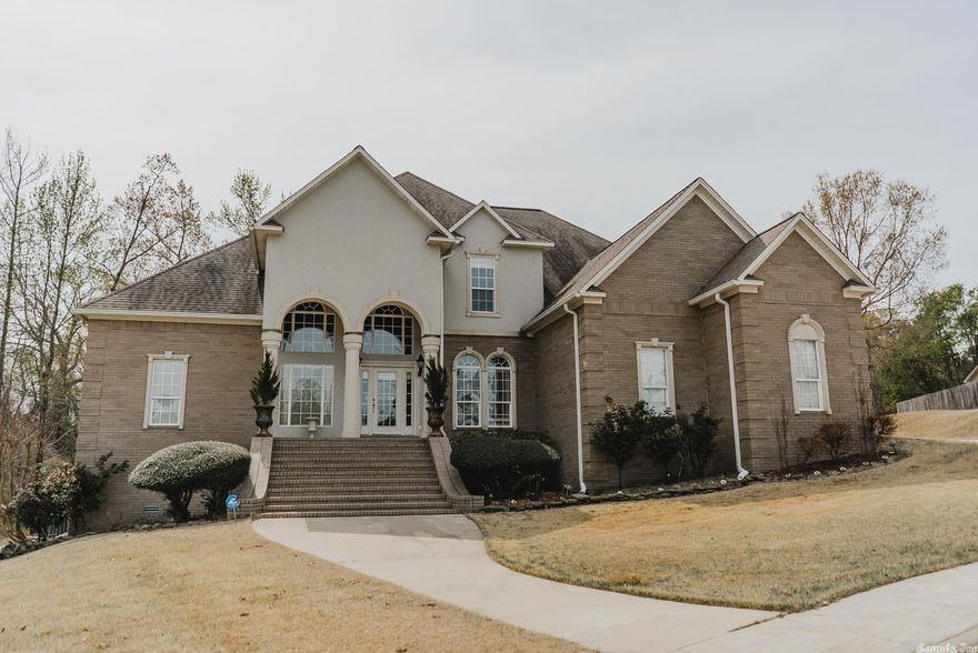 Welcome 163 Gatesway. This custom-built home is located on a quiet cul-de-sac in the Country Club area.  It includes a unique front elevation with double two-story arches supported by tapered colonial columns. Beautiful brick and stucco accents give an added richness to the front elevation. The 4313 SF home has an abundance of customized features.  It contains a gourmet kitchen featuring custom cabinets, granite counter tops, sleek s/s appliances, double ovens, and a walk-in pantry. The breakfast and hearth room are adjoined for a relaxing fireplace setting.  A large master suite with walk-in closets is located downstairs.  The second story features 3 bedrooms, 2 baths, an added bonus and media room. Gatesway has a separate 1500 SF out-building. The building can be used for hobbies, storage, or a potential pool house.  The side yard gives a private cart path to the Monticello Country Club. This home can meet the highest of expectations, A MUST SEE!!