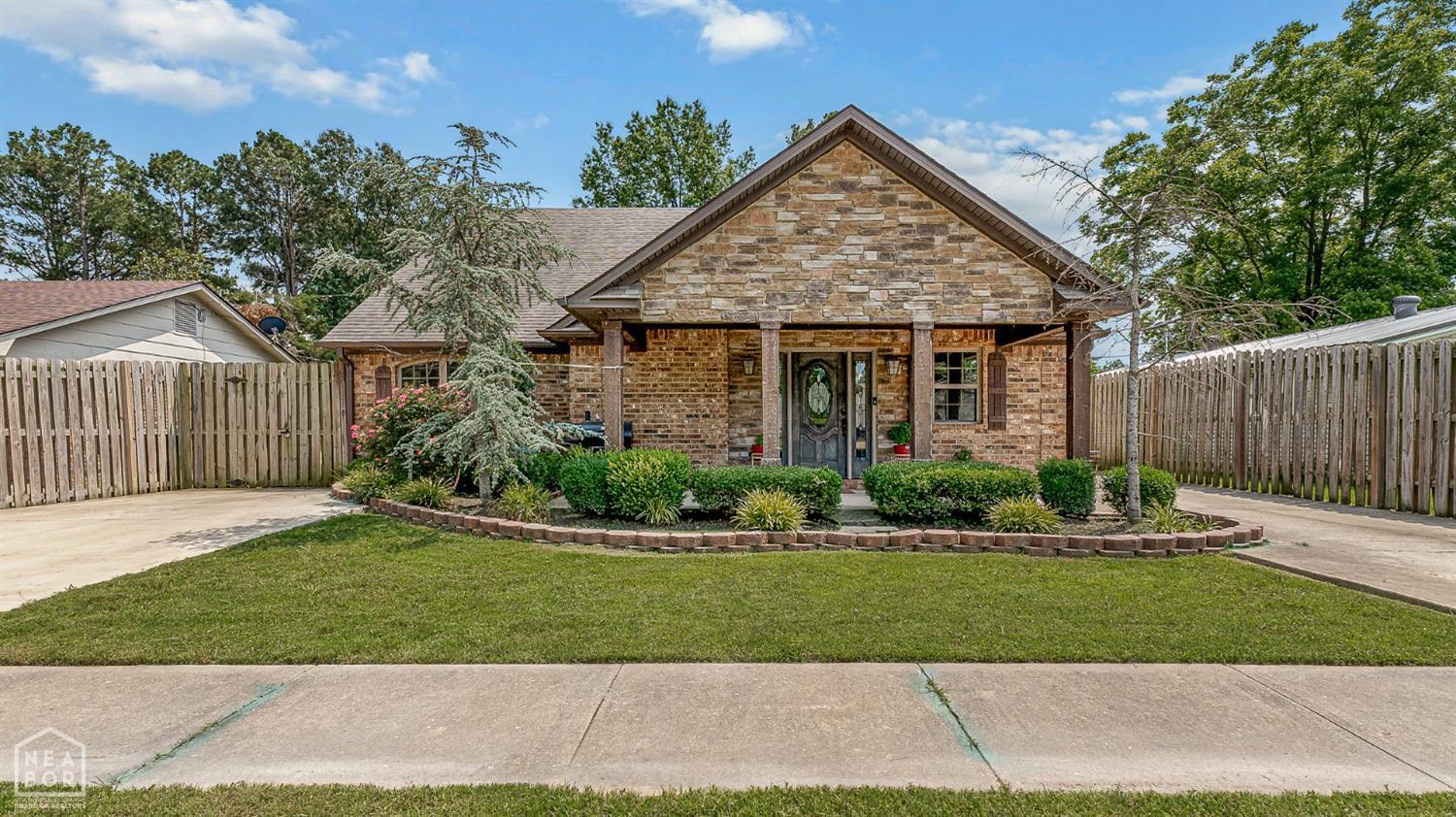 Welcome home to this beautifully crafted 5-bedroom, 3-bath brick home with 3,224 sq ft of living space in the heart of Jonesboro. Enjoy a spacious layout with large rooms, an inviting screened patio, and an oversized laundry room. The generous master suite offers a private retreat, while all bathrooms feature custom tile showers. Elegant details throughout include crown molding, stained wood cabinetry, and granite countertops. This home offers the perfect balance of style, space, and comfort.