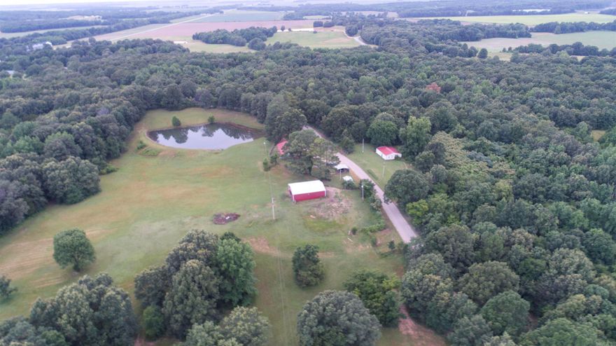 232 County Road 440, Piggott, AR 72454  This stunning property has it all – space, privacy, and endless possibilities. Featuring a 3-bedroom, 2-bath home with a bonus room, this residence is perfect for comfortable country living. Step outside to your 6-foot private fenced backyard, ideal for pets or play.  The real gem, 52 acres of fully fenced land complete with two ponds, a 30x40 utility building, and a 36x48 barn with horse stalls—perfect for livestock, storage, or hobbies. There’s also a 12x24 storage building and an additional structure on the property that could be updated for guest housing, a rental, or in-law quarters.  Whether you’re looking for a hobby farm, equestrian setup, or private homestead, this property offers the flexibility and freedom to make it your own.  Don’t miss this rare opportunity—call today to schedule your private showing! Listed with Forrest Realty | Contact: Theresa Van Barkenhuizen – 870-324-3331