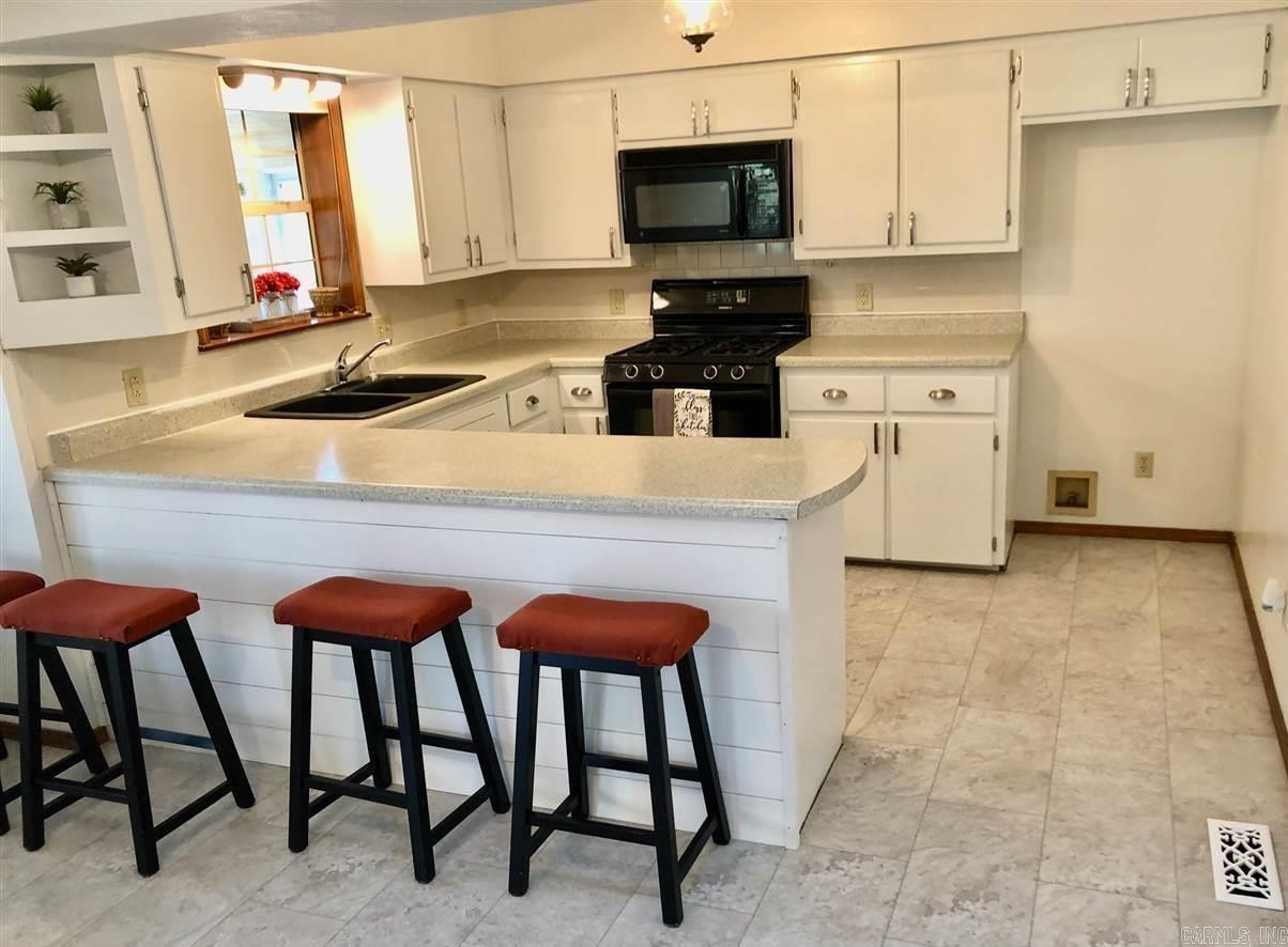 Charming 4-bedroom, 3-bath home in the highly desirable Pebblecreek Subdivision! Nestled on a spacious 0.88-acre M/L lot, this inviting home offers approximately 2,680 sq ft of versatile living space, perfect for families of all sizes. The partially finished walk-out basement adds additional living space with endless possibilities, whether you’re looking for a home office, media room, or extra storage. A bright, open kitchen features a convenient breakfast bar, ideal for casual meals and entertaining guests. The home’s thoughtful layout ensures plenty of natural light throughout , making it feel warm and welcoming. Located just off the bypass, you’ll enjoy easy access to both sides of town, local schools, shopping, and dining. Outdoor enthusiasts will appreciate the proximity to the White River and Lake Norfork, offering fishing, boating, and recreational activities just minutes away. With its blend of comfort, space, and convenience, priced at just $279,900 this home is a must-see!