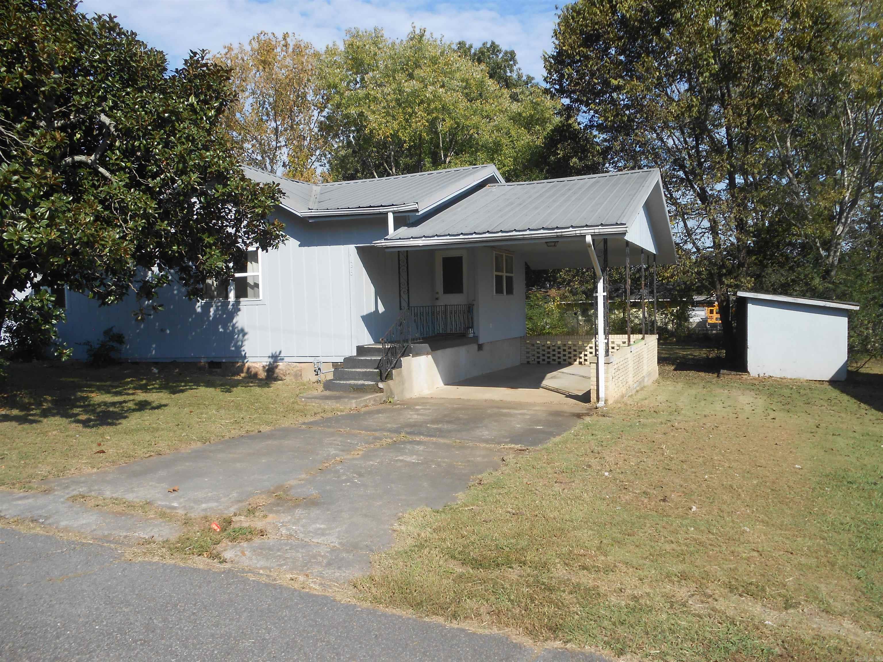 Two houses for the price of one. Front house is 2 b/r 1 bath with c/h/a and carport, 1072 sq. ft. Rear house is a 2 b/r 1 bath, window air and nat gas wall heaters. 792 sq ft. The two houses are about 40 ft apart and would be perfect for parents to live in one and make the other a rent house.  Front house was rented to a high school teacher for 9 years. It's a 5 minute walk and you could come home for lunch.