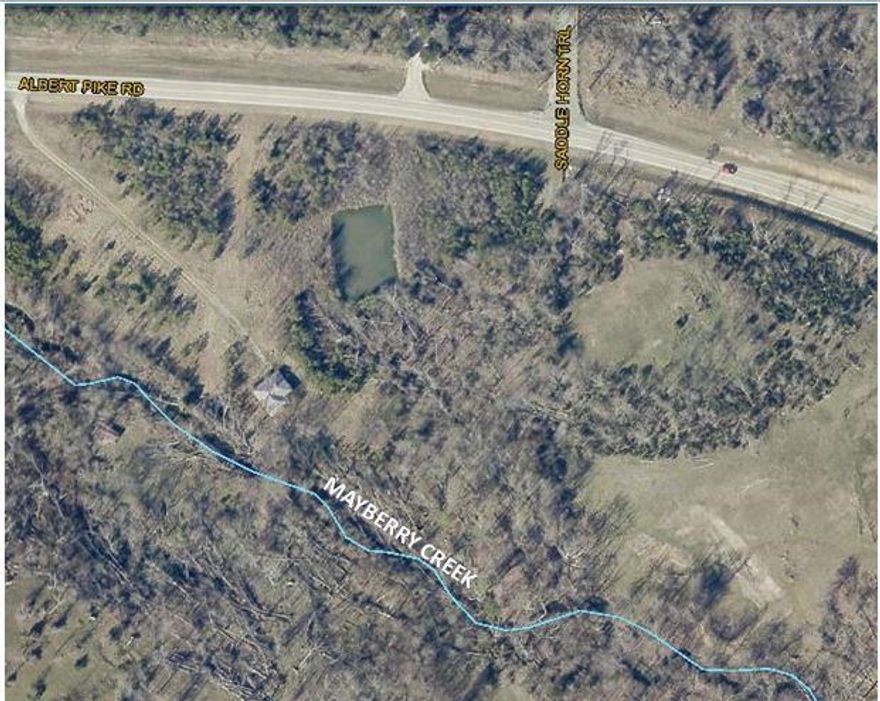 8.7 Acres with commercial or residential potential, level with Mayberry Creek running through  property. Old house place.