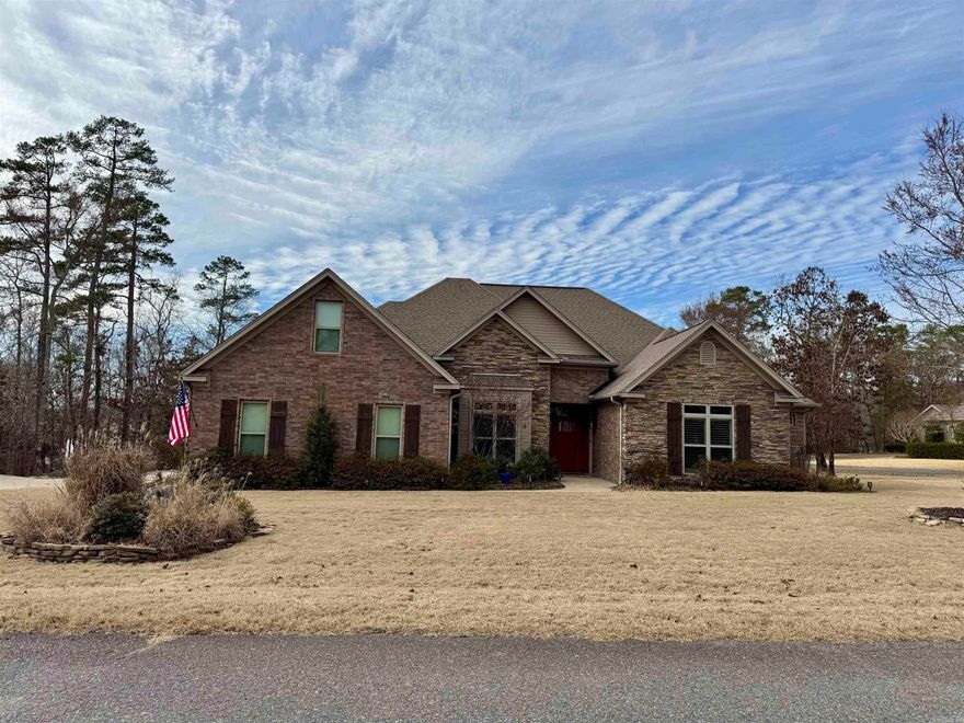 This home is situated on 2 lots in the Lake Balboa area with a slight view of the lake during different seasons, but just a short walk from a perfect view! This home is special being one of the last homes built by Dewayne Bragg, a personal home.  As you enter the home you will see the open living room with a gas fireplace, wood floors, with large windows to view the outside living area. It is all open to the kitchen with beautiful cabinets, a large breakfast bar with lovely granite countertops and tile backsplash!  The dining room is also open to this area which is great for entertaining. There is drop zone in the laundry room and a pantry off the kitchen. There are 2 covered patios, one off of the 3rd bedroom and the other off of the living room, it has a beautiful wood burning fireplace and & built in propane grill.   The home has a wonderful primary suite with 3 closets and an en-suite primary bathroom with 2 sinks, an additional vanity area and lots of storage. The 2nd BDRM also has an en-suite bath and 2 closets. The 3rd BDRM has a large closer & its own patio. There is a detached garage that can be used for a shop.  The attached garage has a double garage and a golf cart bay.