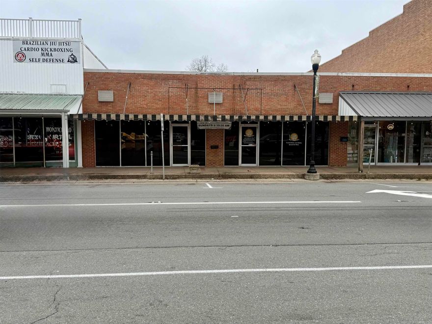 Commercial building located in the heart of downtown. Features a large open interior space, two bathrooms, and a separate back storage room with exterior access. Currently tenant-occupied, making this a great opportunity for an investor or future owner-user. Central location with strong visibility and easy access.
