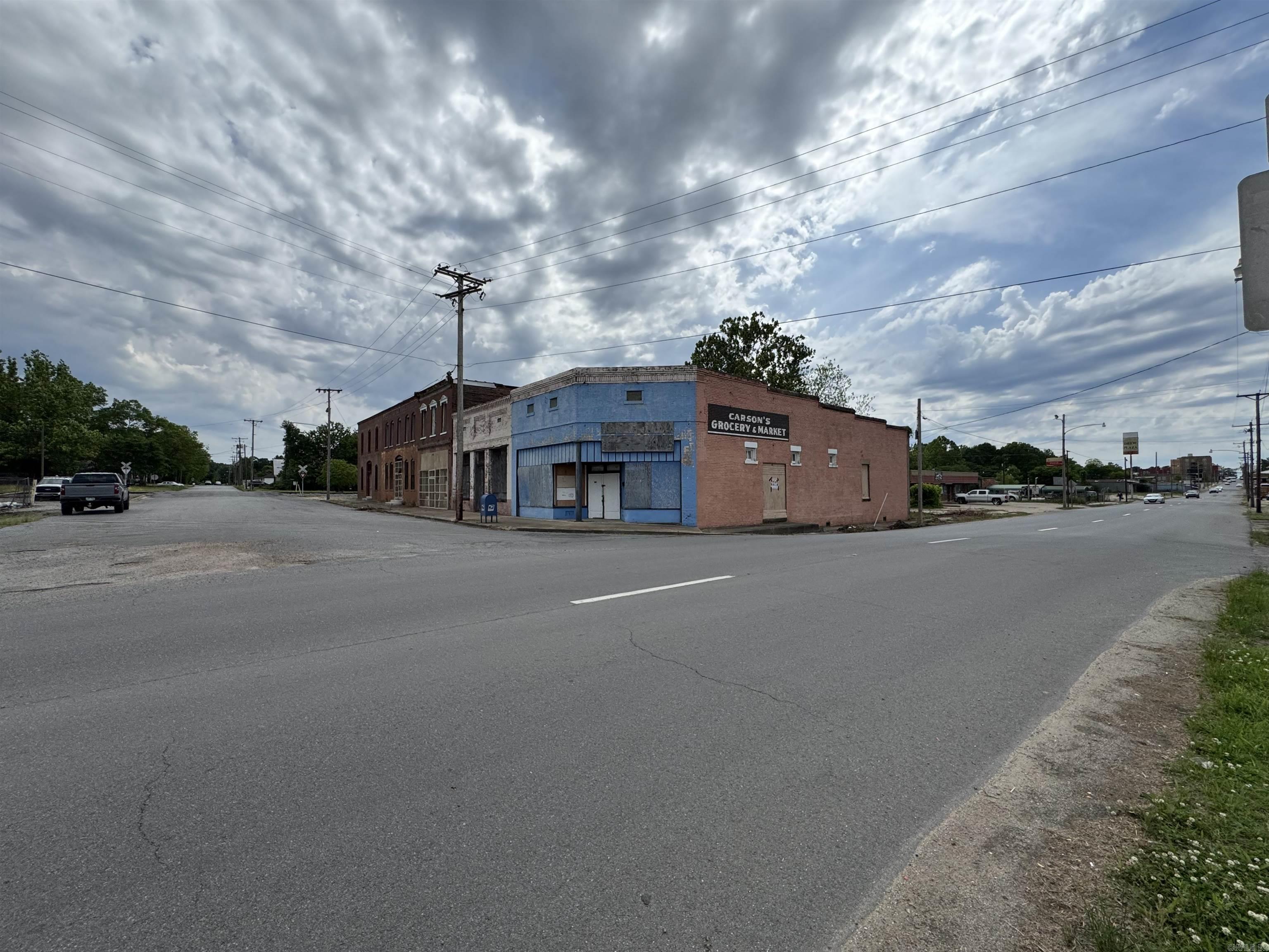 2 buildings on a busy street corner. The buildings do need work. They are old brick buildings with the potential for somebody willing to take on a little work. They do have retail rental potential with some work. These buildings hold a lot of history, you must see the property to really take it in.