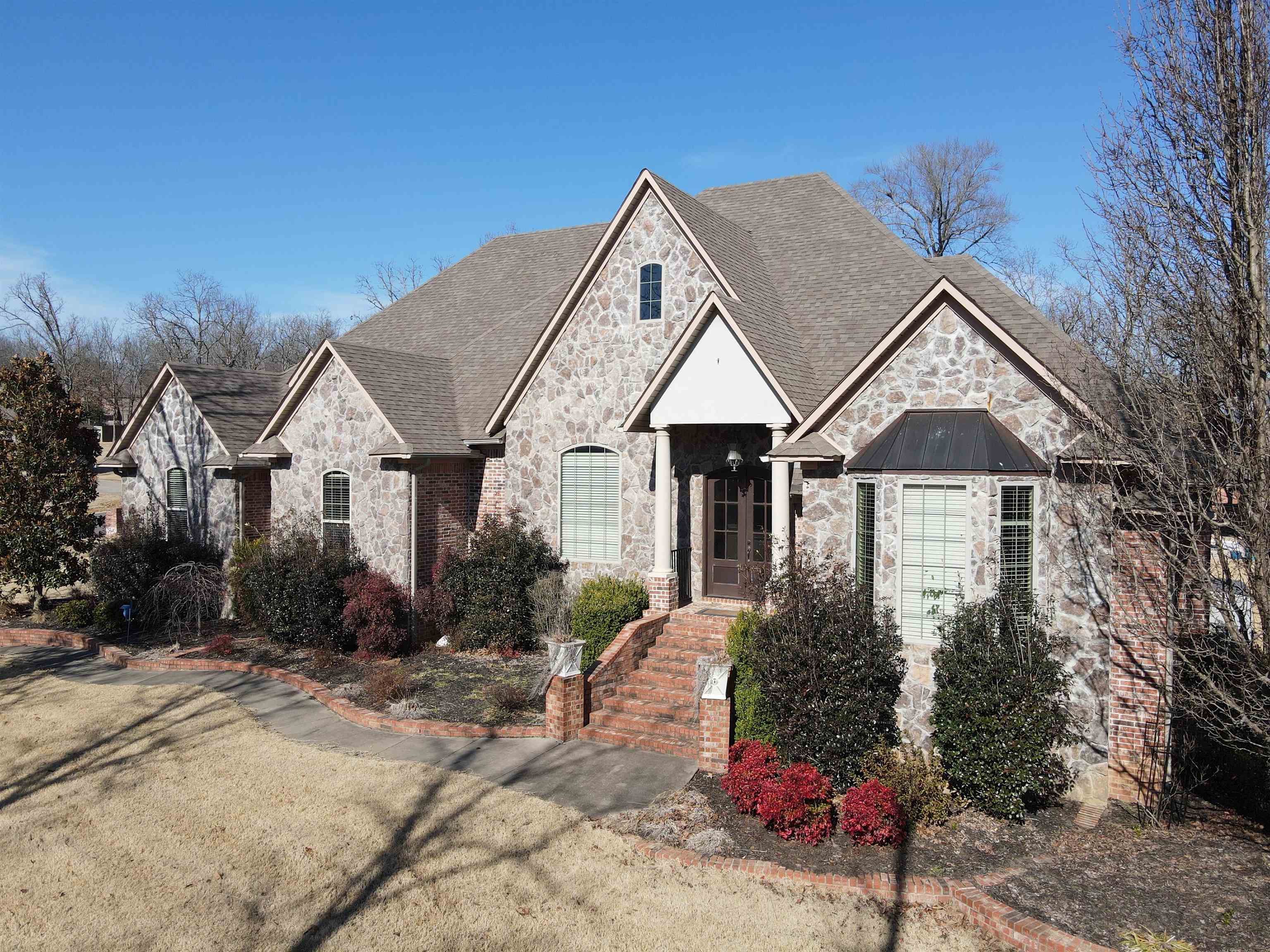 This is a MUST SEE! Gorgeous home with everything you can imagine! 5BR/4.2BD  with rooms upstairs for other options, study, theater room with kitchenette & breakfast nook, formal dining room, walk in huge pantry, butler pantry/wet bar, large 3 car garage. Lots of storage/closets. Outside is an amazing entertaining area with a large Gunite pool that has a slide, water fall, table w sitting area, a hot tub and a full outdoor kitchen! Large pool house with 1BR/1BA a full kitchen and living area.