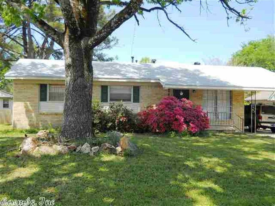 This brick/vinyl 3 bedroom 1.5 bath has hardwood floors throughout except for the wet areas which is tile. Baths have been updated.  Breakfast area has sliding door leading to large deck and level fenced backyard with a 6x8 storage building. The refrigerator 2003 will convey, stove 2003, microwave 2008, hotwater 2011. The roof was installed in 2011 and insulation was brought up to R-30 for energy savings. Located close to inter-state for easy access anywhere. All this home needs is a new family.