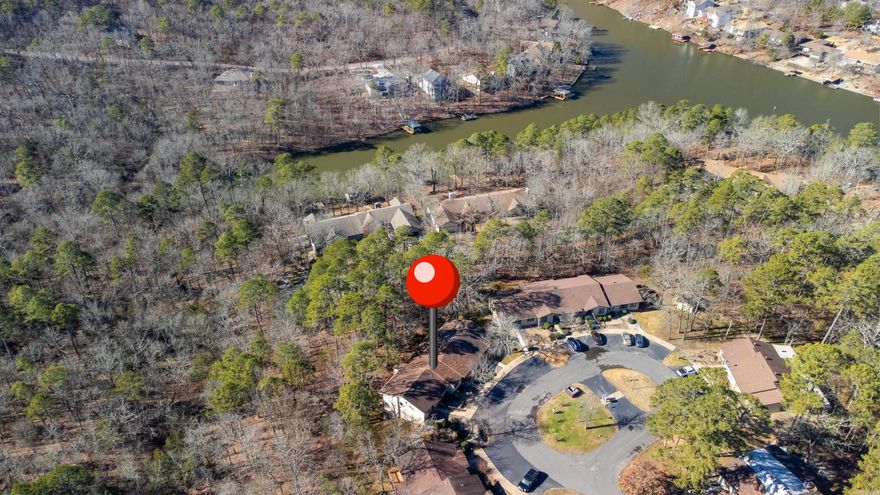 Completely remodeled condo in Hot Springs Village. Living here gives you the opportunity to enjoy all of the amenities HSV has to offer. This home is just a hop, skip, and a jump from Lake Pineda and is located at the end of a cul-de-sac in a quiet neighborhood. There are no stairs to climb, as the front entrance is at street/parking lot level. The roof, HVAC, and plumbing were all replaced in 2021. The home was recently painted with updated LVP floors throughout, kitchen countertop, and a new walk in shower. All of the light fixtures, light switches, and receptacles were replaced. The dining/living room is large with plenty of room for you and your guests. The full bath is a Jack and Jill bathroom, accessible to both bedrooms. The master bedroom has double closets, with ample room for all of your clothing. There is also a large back deck that makes you feel like you are in a tree house. The refrigerator, microwave, washer/dryer, and TV's in the LR and MBR are al included in the sale. ***See Agent Remarks***