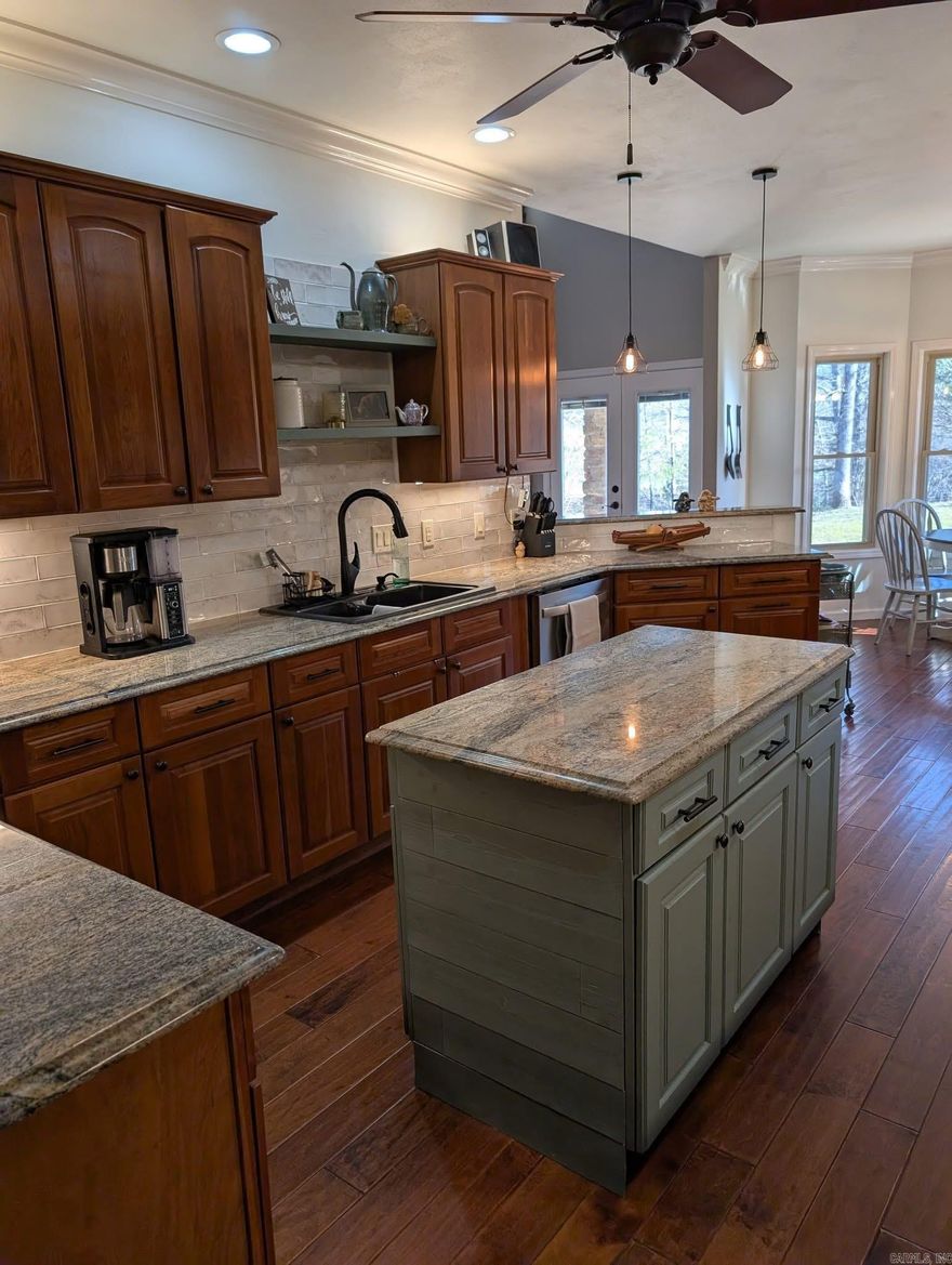 5 acres of fenced and cross fenced pasture in this 4 bedroom/3.5 bath well appointed home that sits on the Mazarn Creek. With 3,237 sq ft