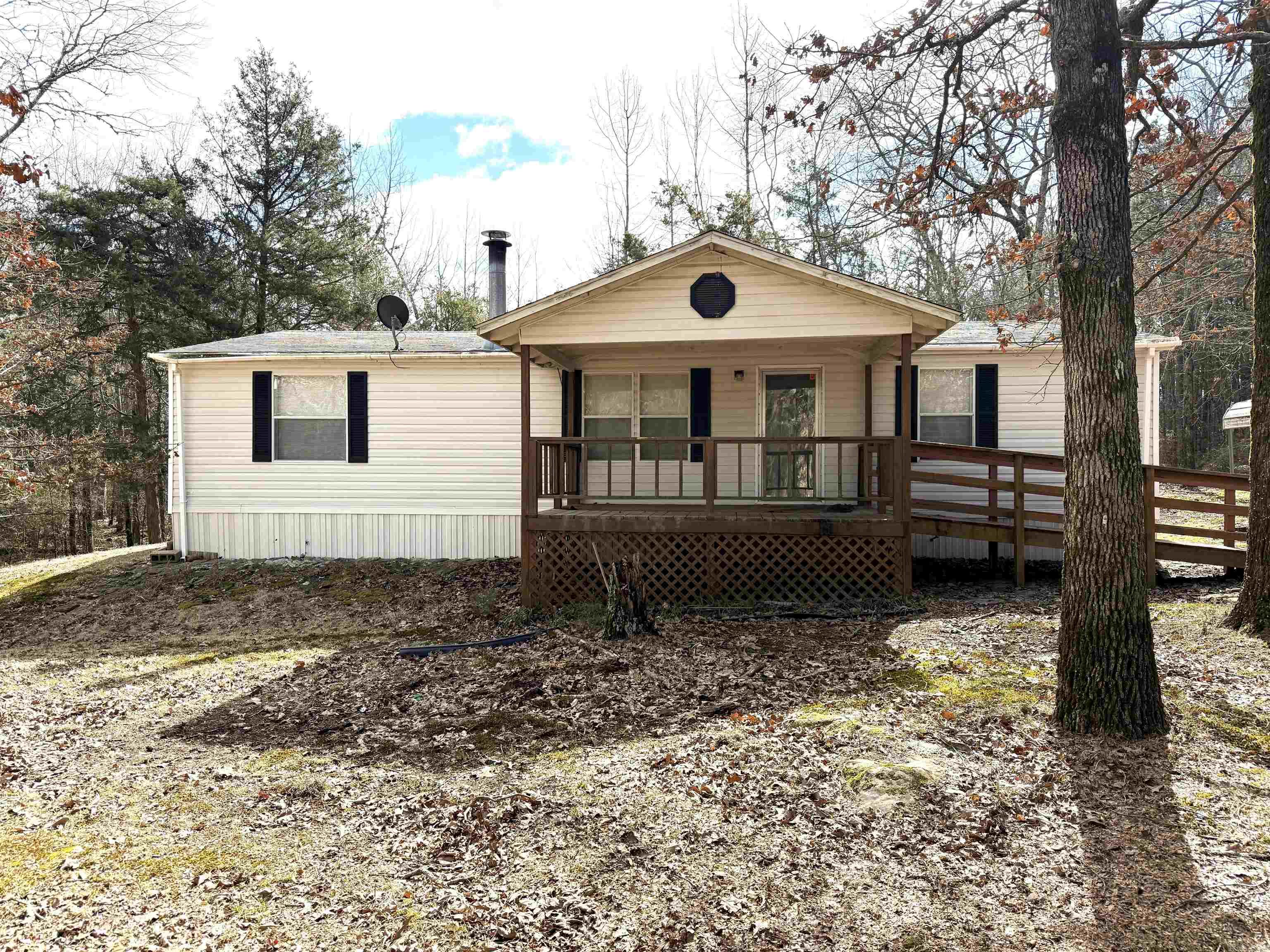 This home has so many possibilities! Would be a great weekend home or full time home. Plenty of room for all your lake toys or animals. 3 bed 2 bath with new flooring in most of the house. Beautiful wet weather creek just to the side of the home with lots of privacy. Lots of outside storage and room to spread out. This home also has a large garden spot, covered front porch, carport, and so much more. Minutes from Sugar Loaf Marina and Park. Home is being sold AS-IS. Give us a call today!