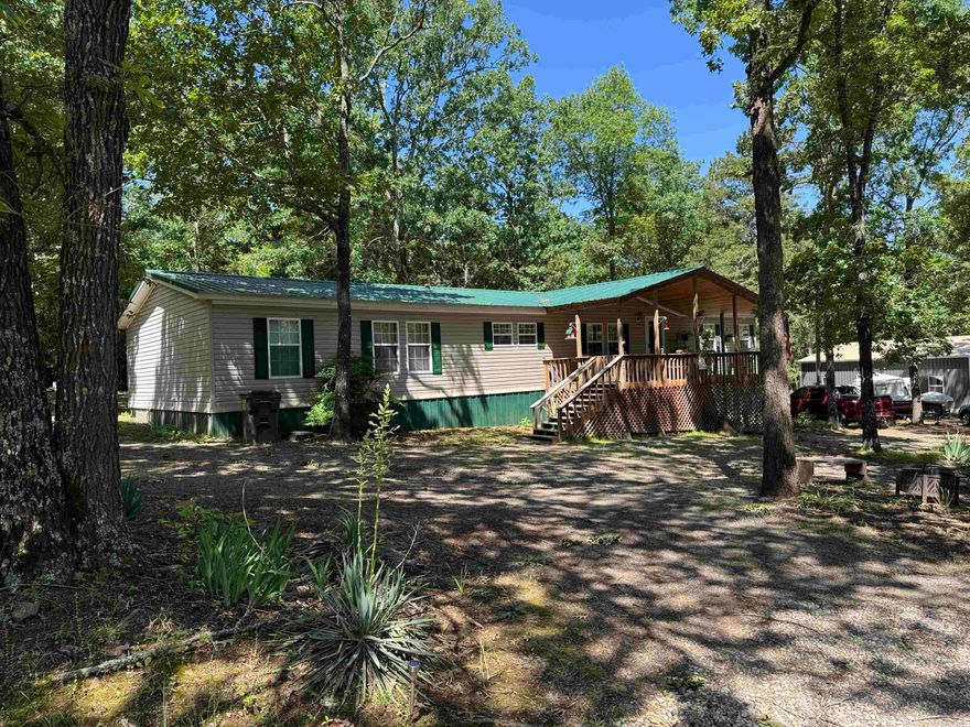 Looking for a spacious house for all the family and friends? This home has it plus your in walking distance to the lake located at the end of this road. This is a 5 bedroom 2 bath with a bonus room off of the living room for an office or a quiet little space for reading. With new carpet, new wood on the porch ceilings, wood burning fire place, newly cleared trees from back yard , new septic system and furnishings are negotiable so come see this before its gone. Call today this wont last long !!!