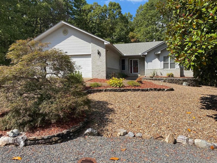 Take the very popular Lynnwood plan and add a 400 Square foot Arkansas Room and a whole house generator and a buried tank which makes for an attractive offering. This move-in ready home has a HVAC from 2021 and a roof from 2007 and water heater from 2023 and generator from 2014. Fireplace has electric insert. Add the vacant lot to the left for privacy. Flooring allowance will cover replacing all carpet with LVP of buyer's choice. And paint allowance will paint all interior walls with buyer's choice of color. No disclosure. Come see and make it yours!