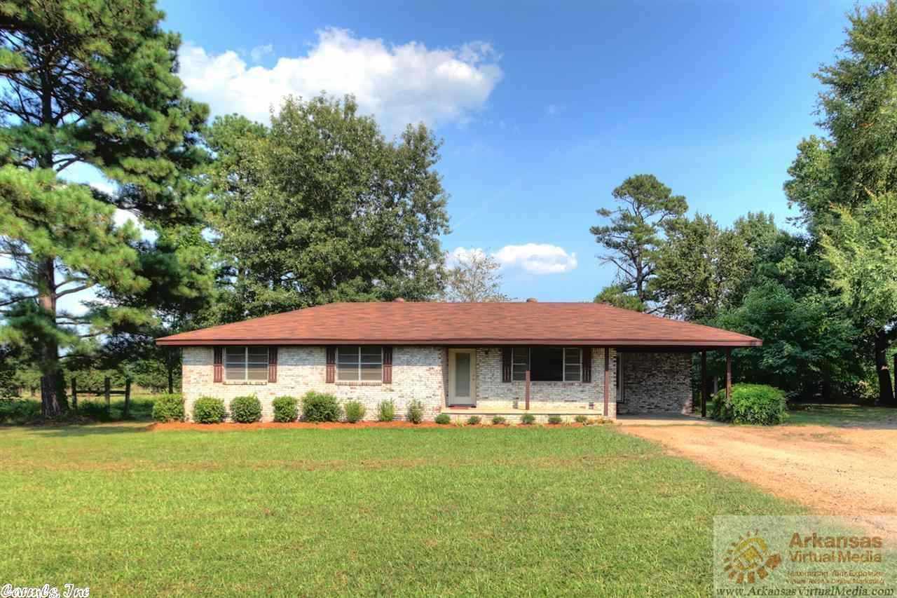 If you want to live out of town a little bit and have a nice home on a little acreage, this is it. Home totally remodeled. It offers pretty kitchen with solid surface countertops, living with hardwood flooring, tile in wet areas and bath, cherry cabinets in kitchen, brick exterior, take a look!!