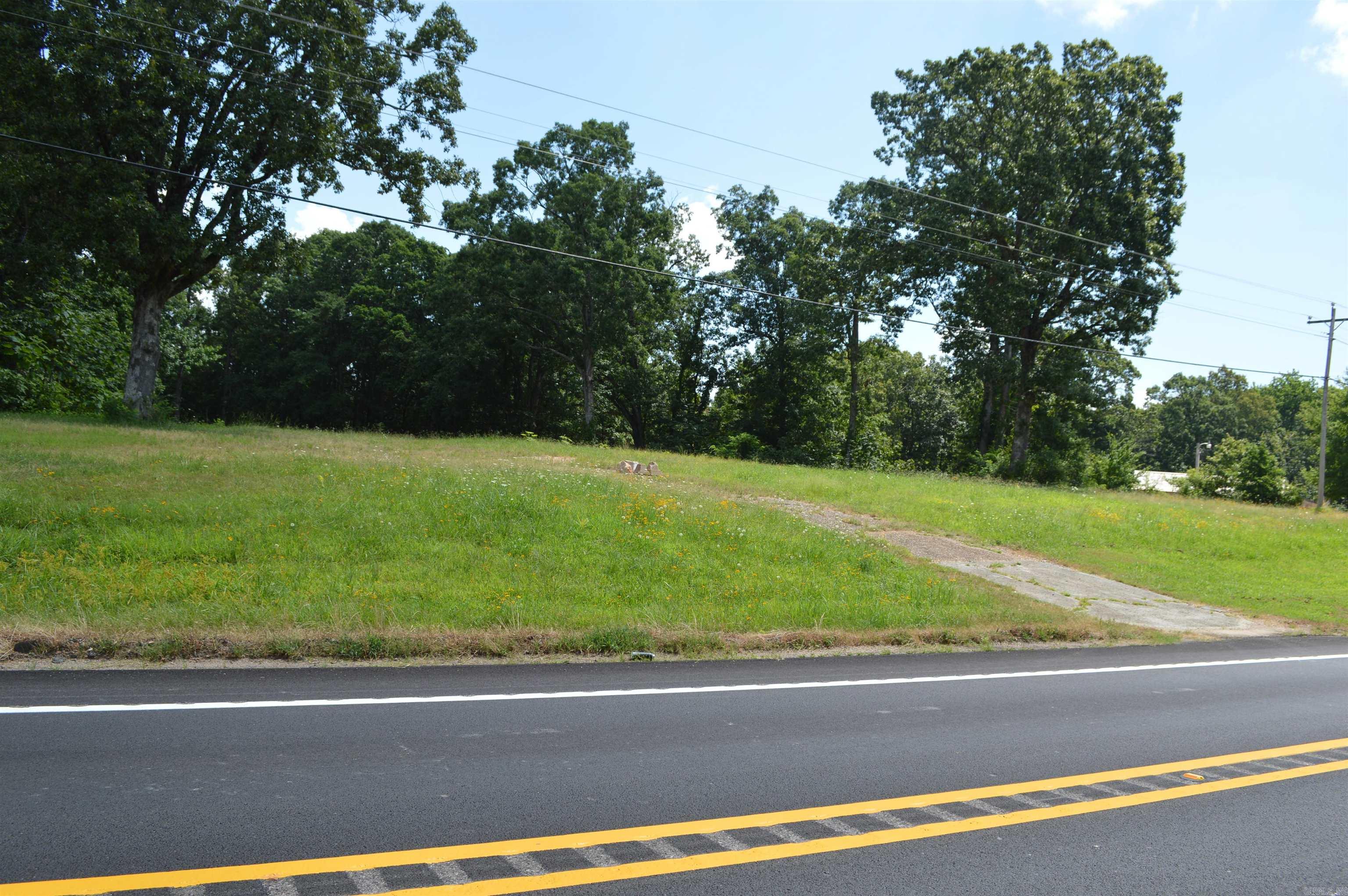This vacant lot at 20141 Highway 14 E presents an exceptional opportunity to build your dream home on the stunning Crowley's Ridge. Enjoy breathtaking views and the peace of country living while still being conveniently close to Harrisburg.