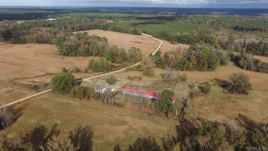 Turn Key Cattle Farm To Build A Home On Down a winding gravel road behind a big rod iron electric gate is where your dream starts. There is an operational cattle farm with fences, pipe fence pins, barns, multiple ponds, a creek, and a barn and field full of hay. Power and water at your convenience at the shop. As if this place wasn't great enough, the awesome news is that there are stellar build sites on the property to add your dream home. Loads of timber surround the fields, creating great wildlife habitat. Deer and turkey are in abundance as an added bonus. This is a great place to raise cattle and enjoy some beautiful sunsets over the south pasture. Call the land specialist for your private viewing today.