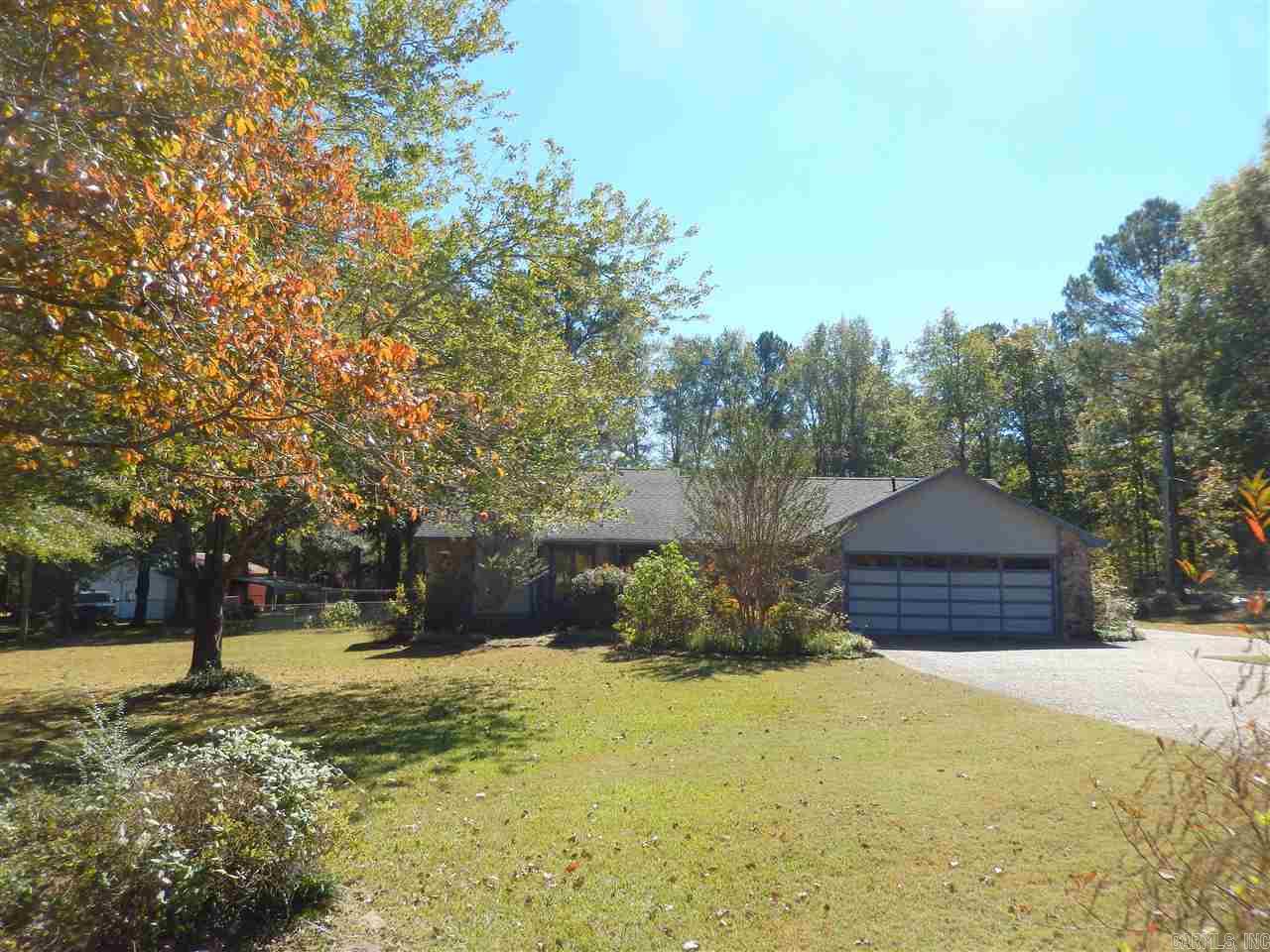 Come see this charming home resting in a country setting just 10 minutes from shopping and restaurants. The home includes a large family room with a bricked fireplace. The chief of the home will love the kitchen with plenty of cabinets and counter space to prepare meals. The master bedroom is spacious and includes a walk-in closet. The covered deck welcomes you into the unbelievable fenced in backyard that has a large workshop with electricity, great storage building. Don't miss this wonderful home.