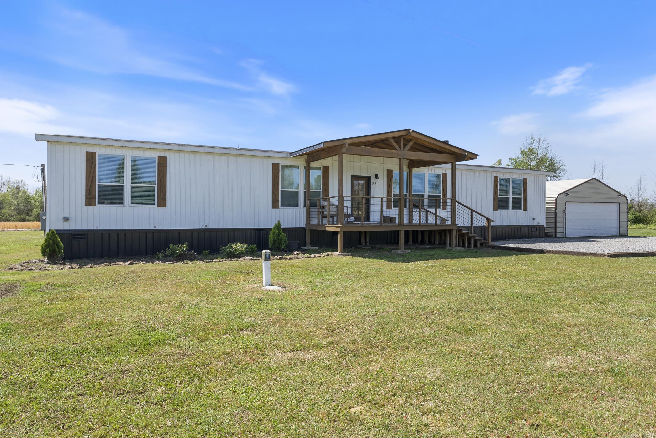 This spacious 4-bedroom, 3-bathroom home sits on 4.73 acres and offers 2,400 square feet of beautifully designed living space. Inside, you'll love the open layout filled with natural light, real wood cabinetry, granite countertops, and stunning 6-inch crown molding and trim throughout. A cozy wood-burning fireplace anchors the living room, while the large kitchen offers plenty of space for cooking and gathering. The primary suite includes a spa-like bathroom with a relaxing soaker tub and a walk-in shower. Step outside and enjoy your mornings and evenings on the oversized front and back porches, complete with oversized full size porch swing on the back. The backyard features a deck already set up for an above-ground pool with electrical hookups ready to go. There's also a 24x30 shop with electric — perfect for hobbies, storage, or extra workspace. Located just minutes from Conway this modular home is set on a permanent foundation and qualifies for FHA, VA, USDA, and Conventional loans.