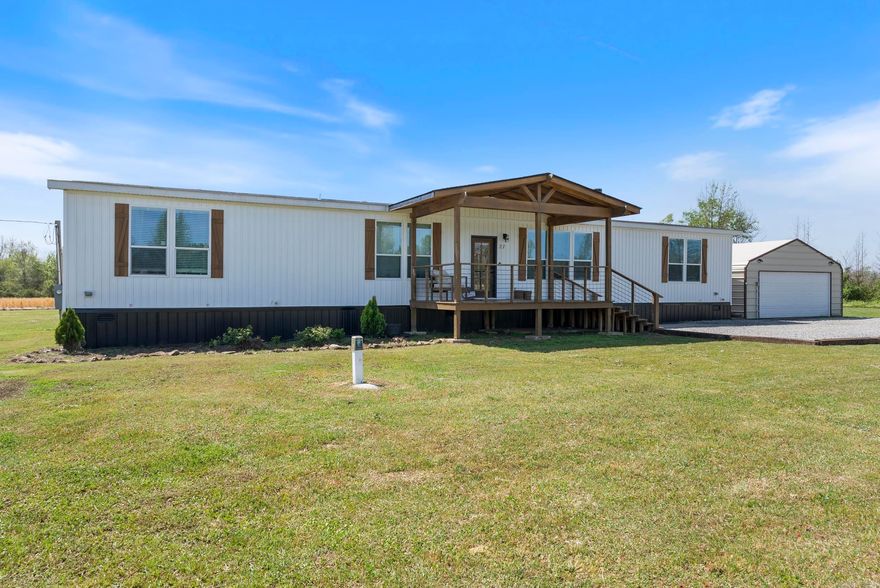 This spacious 4-bedroom, 3-bathroom home sits on 4.73 acres and offers 2,400 square feet of beautifully designed living space. Inside, you'll love the open layout filled with natural light, real wood cabinetry, granite countertops, and stunning 6-inch crown molding and trim throughout. A cozy wood-burning fireplace anchors the living room, while the large kitchen offers plenty of space for cooking and gathering. The primary suite includes a spa-like bathroom with a relaxing soaker tub and a walk-in shower. Step outside and enjoy your mornings and evenings on the oversized front and back porches, complete with oversized full size porch swing on the back. The backyard features a deck already set up for an above-ground pool with electrical hookups ready to go. There's also a 24x30 shop with electric — perfect for hobbies, storage, or extra workspace. Located just minutes from Conway this modular home is set on a permanent foundation and qualifies for FHA, VA, USDA, and Conventional loans.