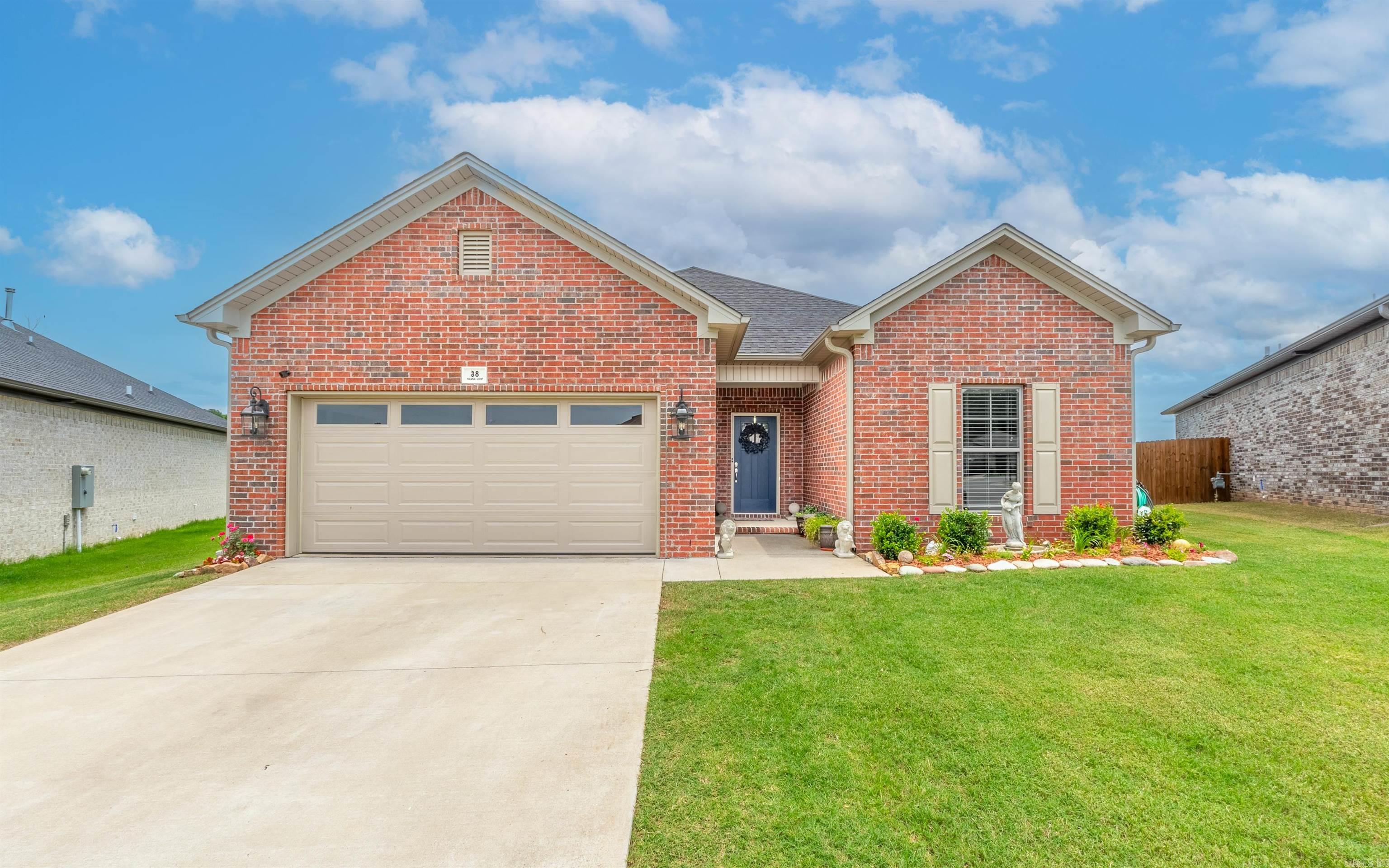 Immaculate custom-built traditional home with modern amenities! This 3BR/2BA gem features an open floor plan, study, and a laundry room with sink. The stunning kitchen boasts upgraded granite countertops, abundant cabinetry, a breakfast bar, island, stainless steel appliances, and a walk-in pantry. Perfect for entertaining, the living and dining areas flow seamlessly. Enjoy the spacious great room with a cozy gas log fireplace and a dedicated dining area. The luxurious primary suite includes a barn door leading to a spa-like bath with a jetted tub, elegant tiled shower with glass doors, double vanity, and a large walk-in closet. The laundry room offers additional storage with cabinets and a sink. The custom study is equipped with built-in bookshelves and a desk. Unwind on the screened-in patio or the extended patio pads. The large, fully fenced backyard features a separate fenced area for garden supplies. Energy-efficient features include; Foam insulated Exterior walls, tech shield roof decking, ZipBoard exterior wrap, energy efficient doors and windows & solar panels enhance this home's appeal - SOLAR PANELS WILL BE PAID BY SELLER & Buyer gets reduced elec bills. Agts see remarks