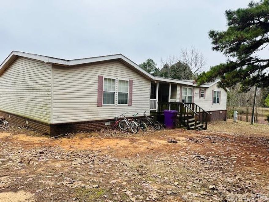 Mobile Home with one acre rural development.Good investment. Needs some work Sold as is.