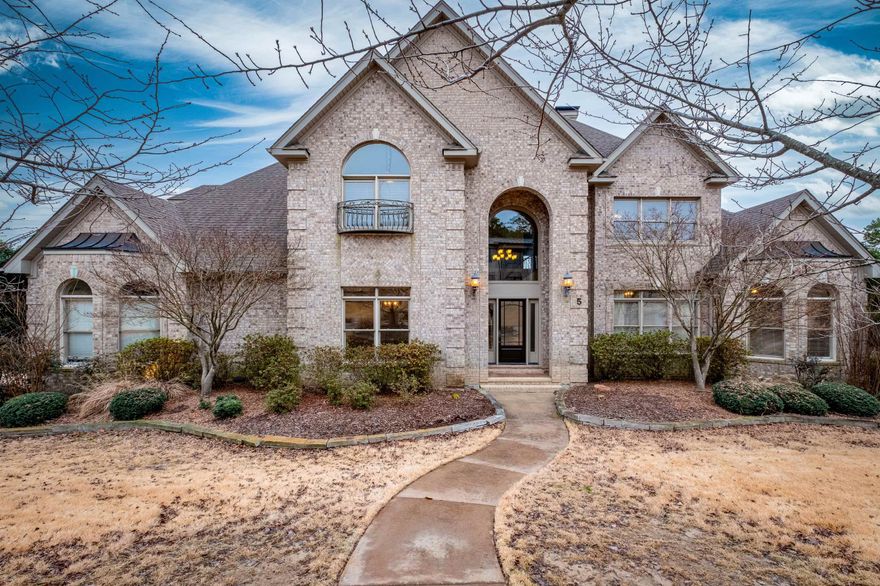 Welcome to the exclusive gated Deauville neighborhood. This 5 bed/4.5 bath home is nestled on a corner lot with three-car side-loading garage, flexible living space w/ tons of storage, refinished hardwood floors, front & back staircases & large yard blends luxury & convenience. Main level has primary suite & separate guest wing w/ en-suite bath, sep office, formal dining rm, breakfast bar & nook, half bath, laundry & large flex space can be another living area/sunroom. Kitchen has large island, double ovens, gas range, built-in microwave & walk-in pantry. Primary suite has access to deck & windows for natural light, and double vanities, walk-in shower, jacuzzi tub & two walk-in closet spaces in bathrm. Upstairs are 3 bedrms w/ walk-in closets, 2 full bathrms, oversized gameroom & media room w/ theater seating, projection screen & dual flatscreens. Expansive deck offers covered/uncovered space overlooks backyard making entertaining easy. Walk-in crawlspace for additional storage. Whole-home generator, epoxy finish on garage floor, built-in cabinets for storage & workshop. Refrigerator, washer/dryer, window treatments, mounted TVs, fire pit table gas grill stay. Roof '16/WH '21.