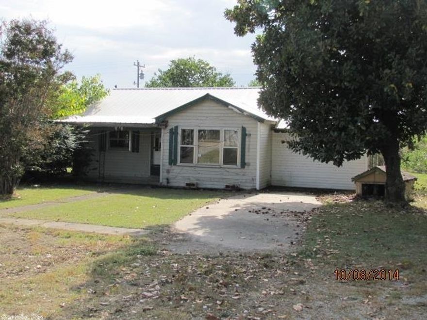 Great investment opportunity for the handyman! This 1449 Sq. Ft. home has a recently installed metal roof and new floor decking in the main rooms. Wiring is intact with 100 amp service. Ready for insulation, drywall, cabinets, fixtures and floor coverings. Bathroom fixtures in place, water heater in place. Ceilings are intact. Garage enclosed for additional living area or a 3rd bedroom. No HVAC. Was previously heated with a gas stove - gas lines and vents still in place. Storm shelter in private back yard.