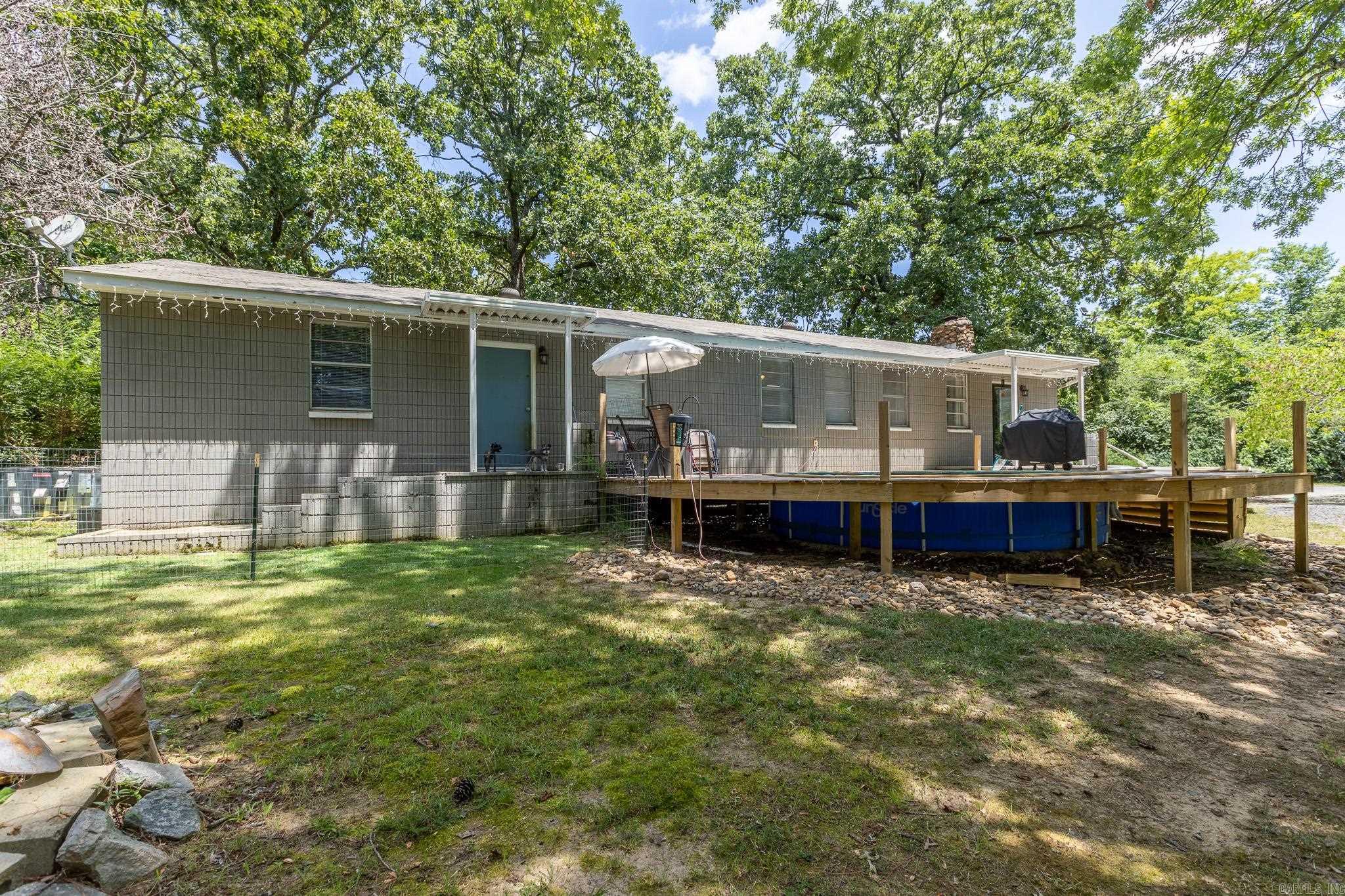 Welcome home to your private retreat on over 3/4 of an acre in the heart of Sherwood! This charming 3-bedroom, 2-bathroom home has been remodeled and is waiting for you. A stocked pond and all of the relaxation just waiting on you to get home each day. Not a pond person? No worries, cool off in the above-ground pool or lounge away on the new deck. This home is the perfect blend with a little country living and still close enough to everything else! New roof in 2020 & waterproof barrier installed with dehumidifier. Half bath expanded to full bath with walk-in shower!. Come take a look for the full list of improvements. Don't let this belong to someone else! Agents: Please see remarks.