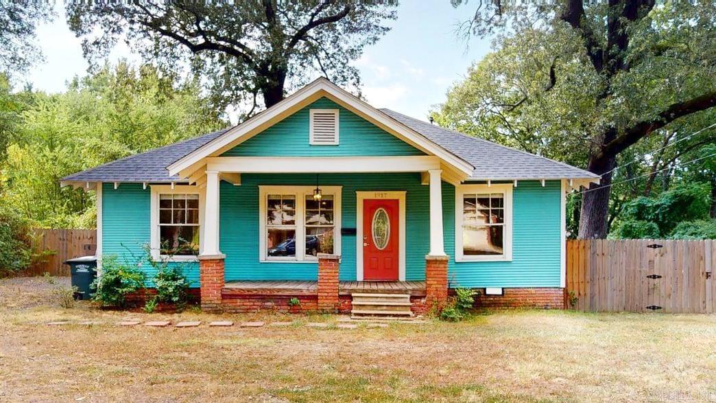 Historic 3 bed/2 bath bungalow offers the perfect balance of charm and modern convenience on a spacious .4 acre lot. This home combines timeless character with everyday comfort. It features a fully updated kitchen with contemporary finishes including stainless steel appliances, granite counters with breakfast bar, and tile backsplash with open shelving as well as a large walk in pantry. It opens to the living room and is filled with natural light Primary bedroom is separate and has a walk in closet & adjoining fully updated full bathroom with clawfoot tub, walk in shower, and backlit mirror. Laundry room is in primary bath and includes washer/dryer. Two guest rooms both with good size closets and a bathroom in between. The backyard ready for entertaining, gardening, or simply relaxing. A rare opportunity to own in downtown Conway.