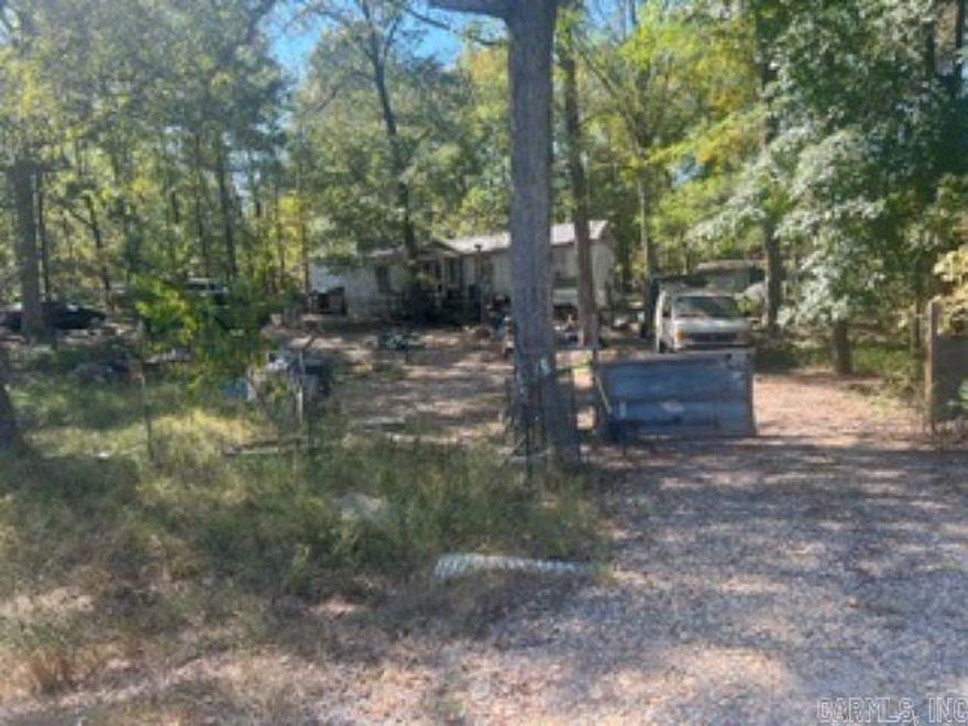 MOBILE HOME NEEDS WORK CANNOT BE FINANCED. LOT IS A LITTLE LESS THAN AN ACRE. ALL UTILITIES AVALIABLE. CASH ONLY-AS IS.