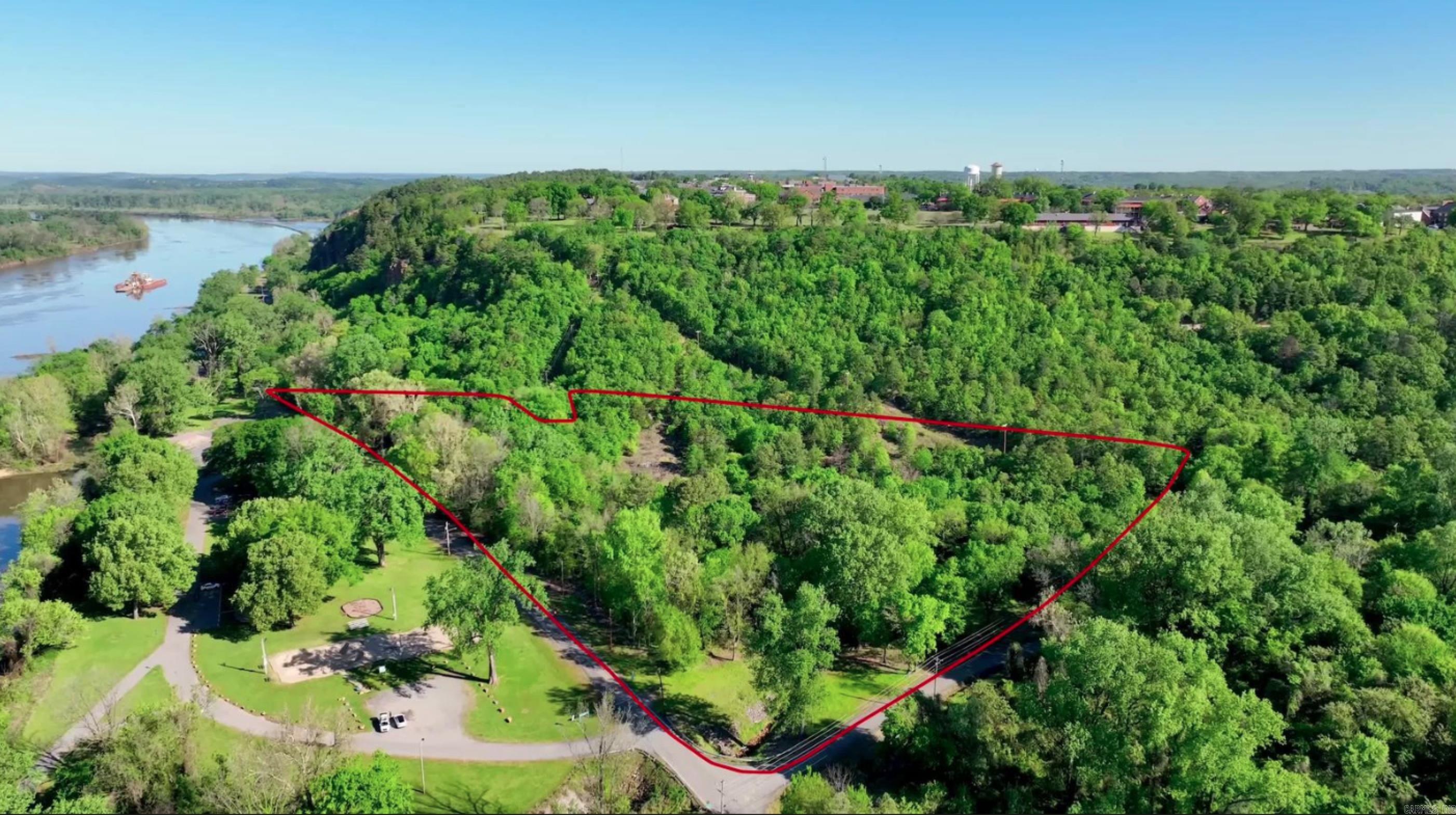 This is North Little Rockās newest gated subdivision that has a triple tiered elevation for just over 20 pad ready lots with gorgeous views over the Arkansas River, while being wrapped with 40 acres of the City Parkās protected greenery, as well as access to the Emerald Trail, 2 great bike parks, the boat ramp, and incredible convenience, being 5 mins or less to the Downtown River Market, the New Argenta District, and/or Dickey Stephens Park. 450 Cubic Yards of dirt was moved to ready these luxurious lots that will each be about .25 Acres. Weāll have 3 modern style gates, one for each elevation tier. Each home will be ~2.5-5k Ft² and should all be blessed with their own views over the Broadway Bridge, the River Trail, or the Capitol building of Little Rock.
