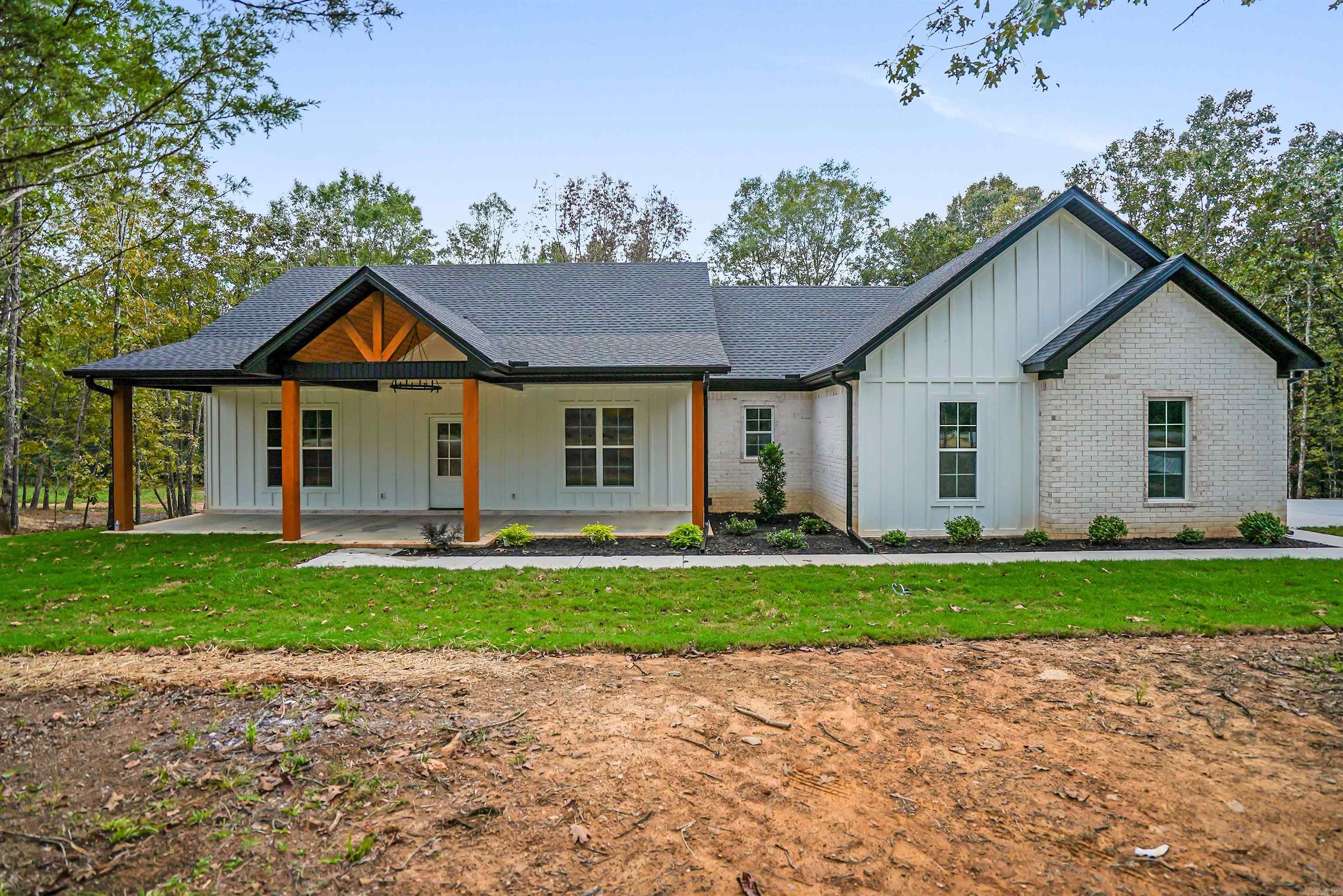 Brand new construction on 1 Acre in Vilonia! This beautifully crafted 3-bedroom, 2-bathroom home is one of three exclusive builds on Sellers Road by the reputable Emerald Custom Homes—and it's ready for its new owners! With 1,768 sq ft of thoughtfully designed living space sitting on a spacious one-acre lot, this home blends modern comfort with country charm. Step inside to enjoy tall ceilings that add an open, airy feel and a spacious kitchen featuring a walk-in pantry and an abundance of cabinet storage—perfect for home chefs and entertainers alike. Whether you're looking to settle down or upgrade your lifestyle, this home offers the space, quality, and tranquility you’ve been searching for—all just a short drive from local schools and amenities. Tax data for lot only. Schedule a tour now!
