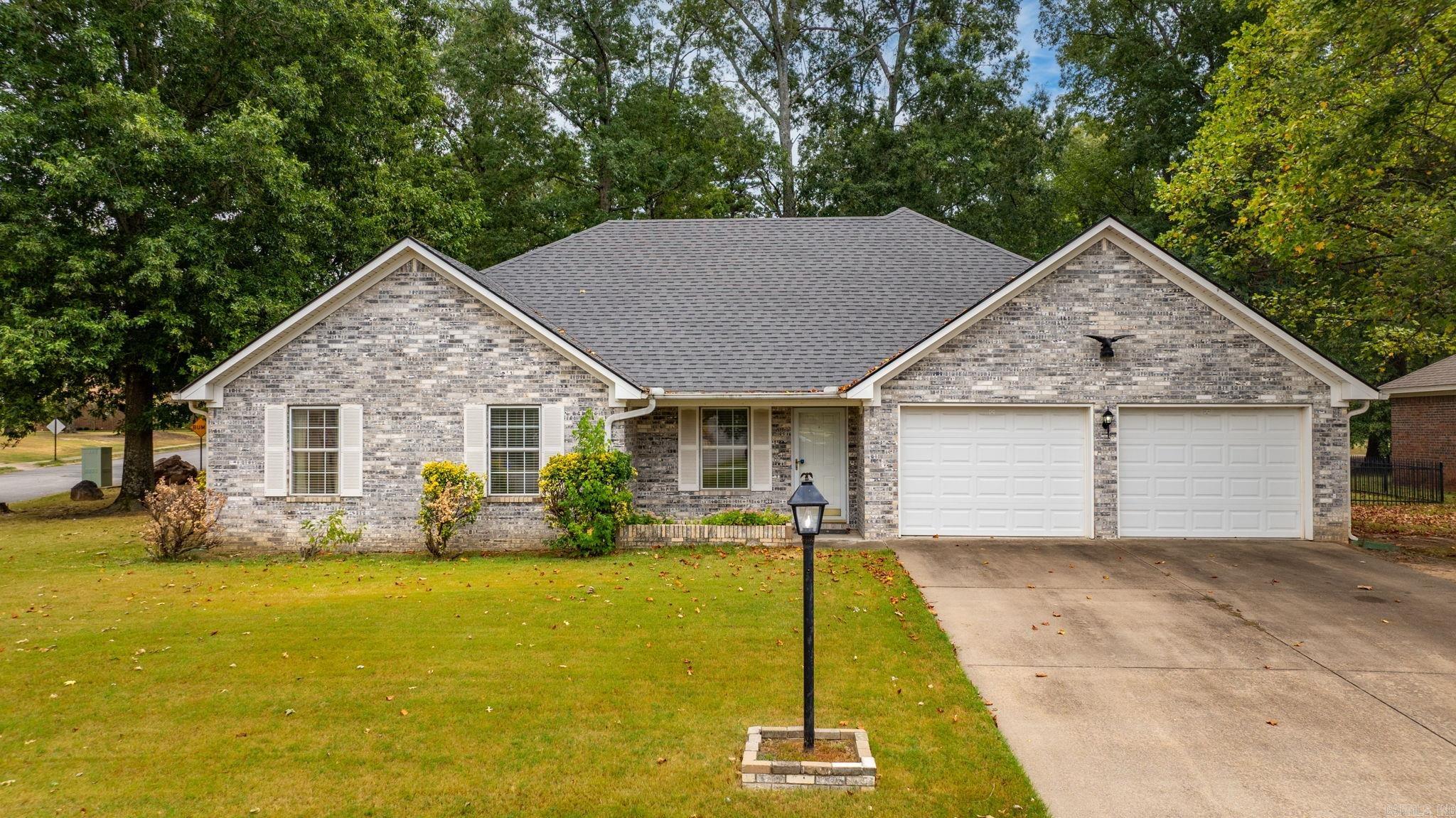 Welcome to the Country Club of Arkansas neighborhood in Maumelle! This charming 3-bedroom, 2-bath home sits on a large corner lot shaded by mature trees and backs directly to the 7th tee box of the golf course. Perfectly positioned near shopping, dining, top-rated schools, and with quick interstate access, you’ll enjoy both convenience and a beautiful setting. Step inside from the inviting front porch to find a welcoming living/sitting room, an open kitchen with breakfast bar, and a spacious dining area that flows into a large den with a cozy gas fireplace and custom built-ins. The primary suite features its own full bath and walk in closet, while two additional large bedrooms—one with built-ins—share a generous guest bath. A separate laundry room adds function and storage. Out back, relax on the large covered porch while taking in serene golf course views from the fenced yard. The oversized garage offers parking for two cars, space for a golf cart, plus a workshop area with a built-in bench and sink. Lovingly maintained by its original owners, this home is move-in ready and being sold AS-IS—a perfect opportunity to add your personal touch. Priced to sell! (Agents, see remarks.)