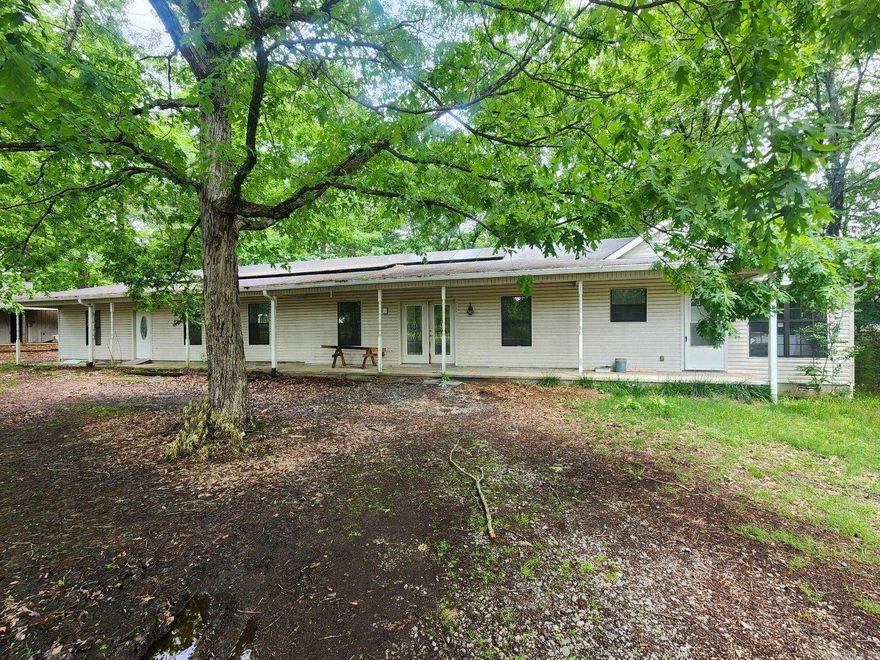 Wonderful property, in the center of Bryant, with 1.5 acres. Great investment opportunity or fixer upper.