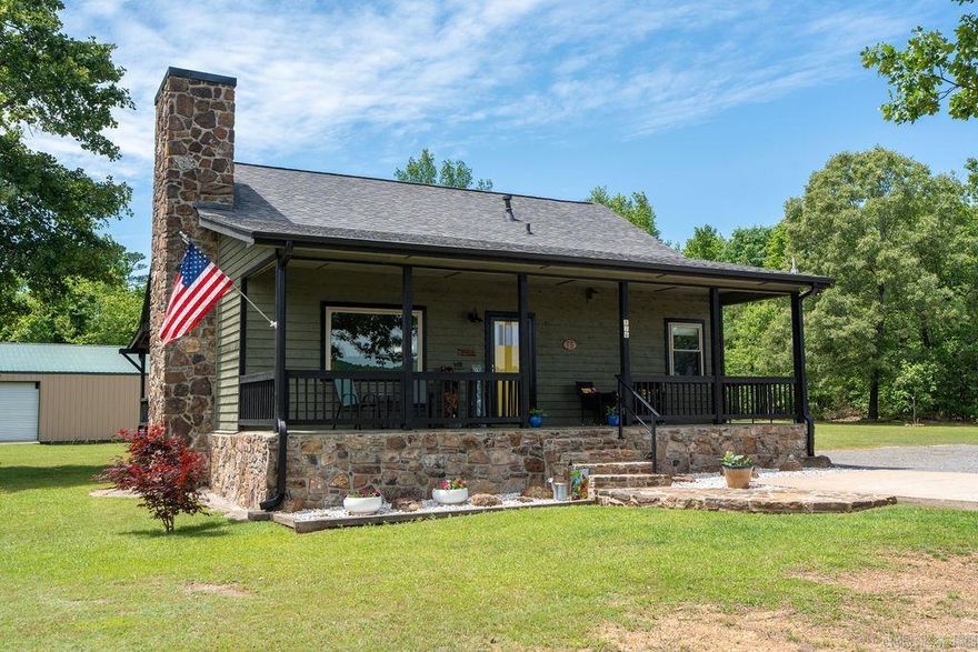 This beautiful, newly renovated 1,156 sq ft Craftsman-style cabin offers 2 bedrooms and 1 bath, combining rustic charm with modern upgrades in a very spacious home that is meticulously kept both indoors and outdoors. The open floor plan is perfect for relaxing or entertaining, featuring a main living area with durable LVP flooring. The updated kitchen showcases new granite countertops, a gas cooktop stove, new fixtures, and a new sink, flowing seamlessly into the living space. The bathroom has been tastefully remodeled with a new marble top vanity, new sink, and updated fixtures. Additional improvements include a roof less than 7 years old, new windows, an updated back deck, and fresh paint inside and out, making this home truly move-in ready. Outside, you’ll find a 30’x40’ shop with two roll-up doors—ideal for lake toys, vehicles, or additional workspace—along with a charming garden shed with shelving and a work counter. The property also features 50 amp RV service and plenty of land for expansion. Located just 0.6 miles from Tannenbaum Golf Course and minutes from the lake, this property offers the perfect blend of comfort and resort-style living.