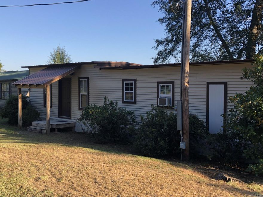 Upper White Oak Lake property that provides a beautiful and peaceful view from the 10x35 covered deck. Private dock and shoreline access. You will admire all of the many updates the owners made to this two bedroom, one bath structure. Partial list of improvements include complete RE-wired. All new plumbing, new kitchen cabinets and countertop, siding, windows, flooring, lighting, fans, electric baseboard heating, deck, metal roof.