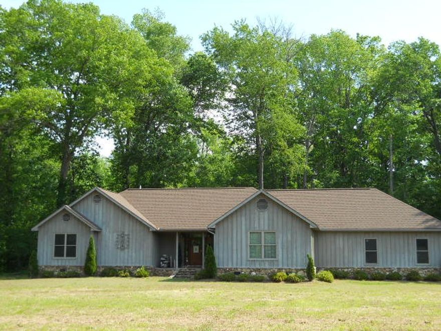 Fabulous home has it all. Listed BELOW appraisal Gorgeous crown molding, cathedral ceiling in great room, gas fireplace, wood floors, wired for sound,dream kitchen fantastic for entertaining, granite countertops, cherry cabinets, full complement of appliances, 6 burner gas stove. Oversized master bedroom bath  walkin closets.  Full laundry with builtins.  Split bedroom plan, all  on one floor. Covered deck on back, large garage with shop, floored attic.Walking distance of Lobo Landing.  Furnishings neg.