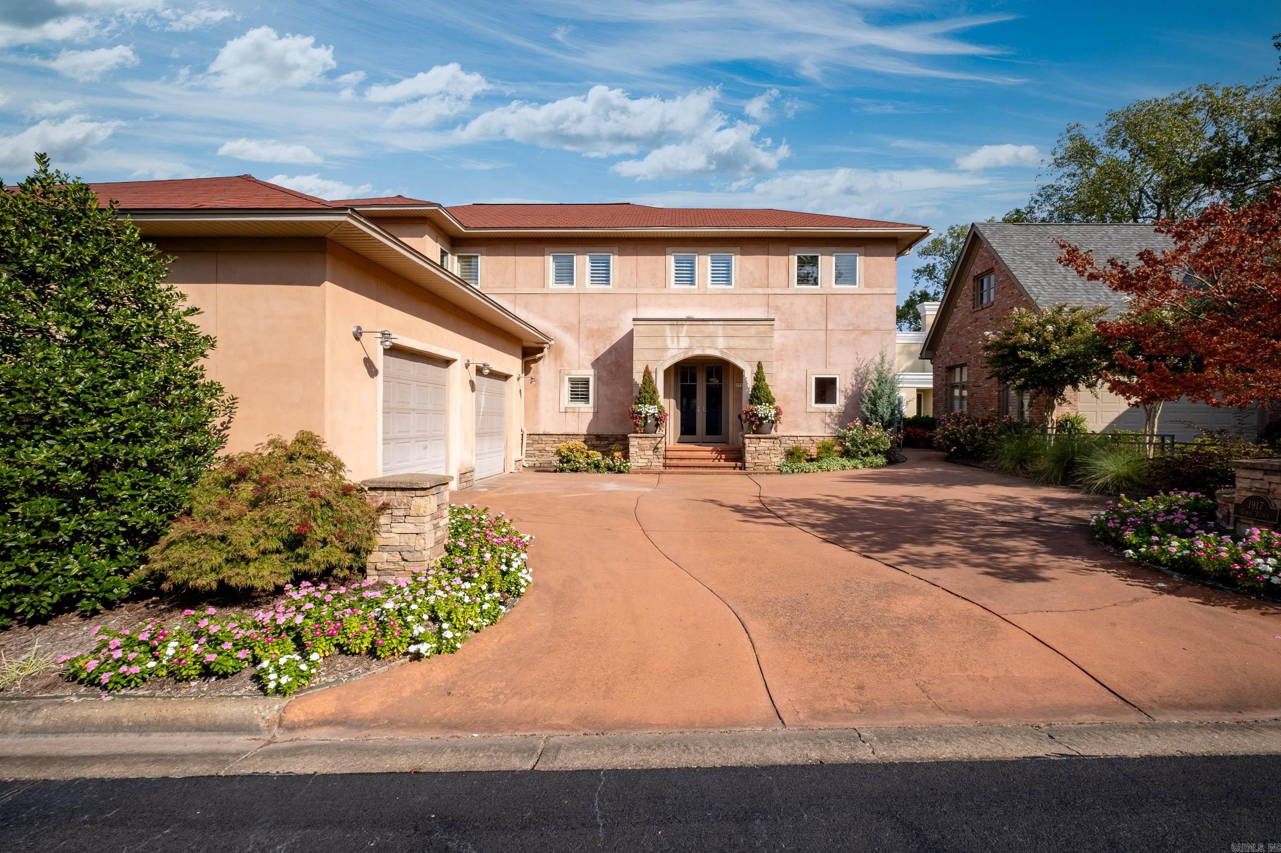 Terrific custom built home in gated community. Main level features 10' ceilings, open living with wood burning fireplace, dining, kitchen, additional living and full bath. The living areas open to spacious covered porch with river views and has built in grill. Upstairs has sitting room separating two bedrooms which includes the primary suite and glassy office with river views. Laundry room is convenient to bedrooms. The oversized two car garage has great storage. Heated floors in kitchen, bath and office. Excellent condition.