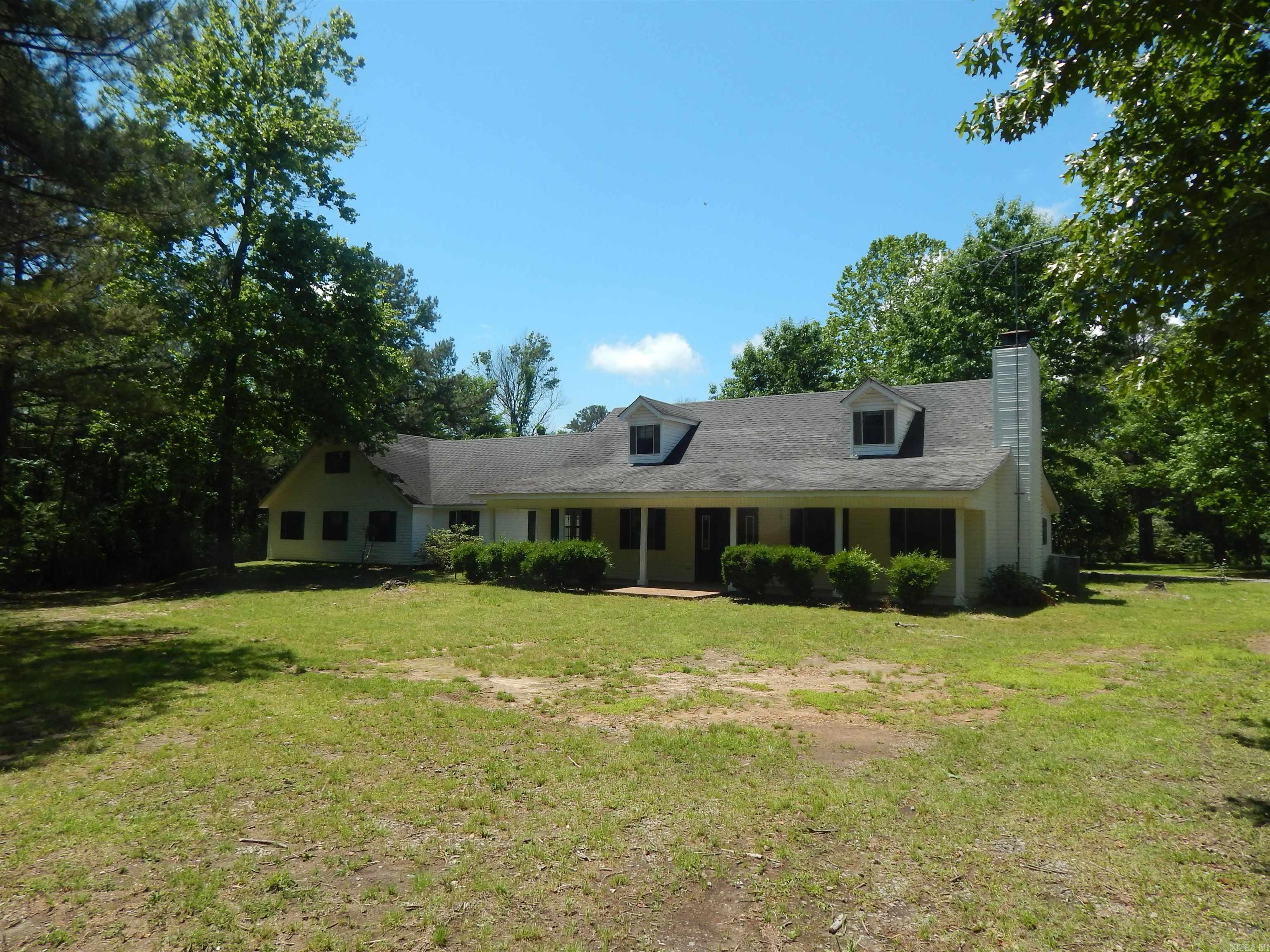 Great opportunity in the heart of Rose Bud. 2 unrestricted private acres with 2,747 sq ft home. 3 Bed 2 Bath with lots of possibilities. 2 living areas, large bonus room and lots of storage. Office with outside entrance, could serve as an additional bedroom or living area. 3 car garage and outside storage buildings. Nice private lot with mature trees. Just across the street from the school. Walk to school and all the school functions. School also has a community safe room for bad weather conditions. Economically priced AS-IS. Home is ready to move in or make changes to make it your own.