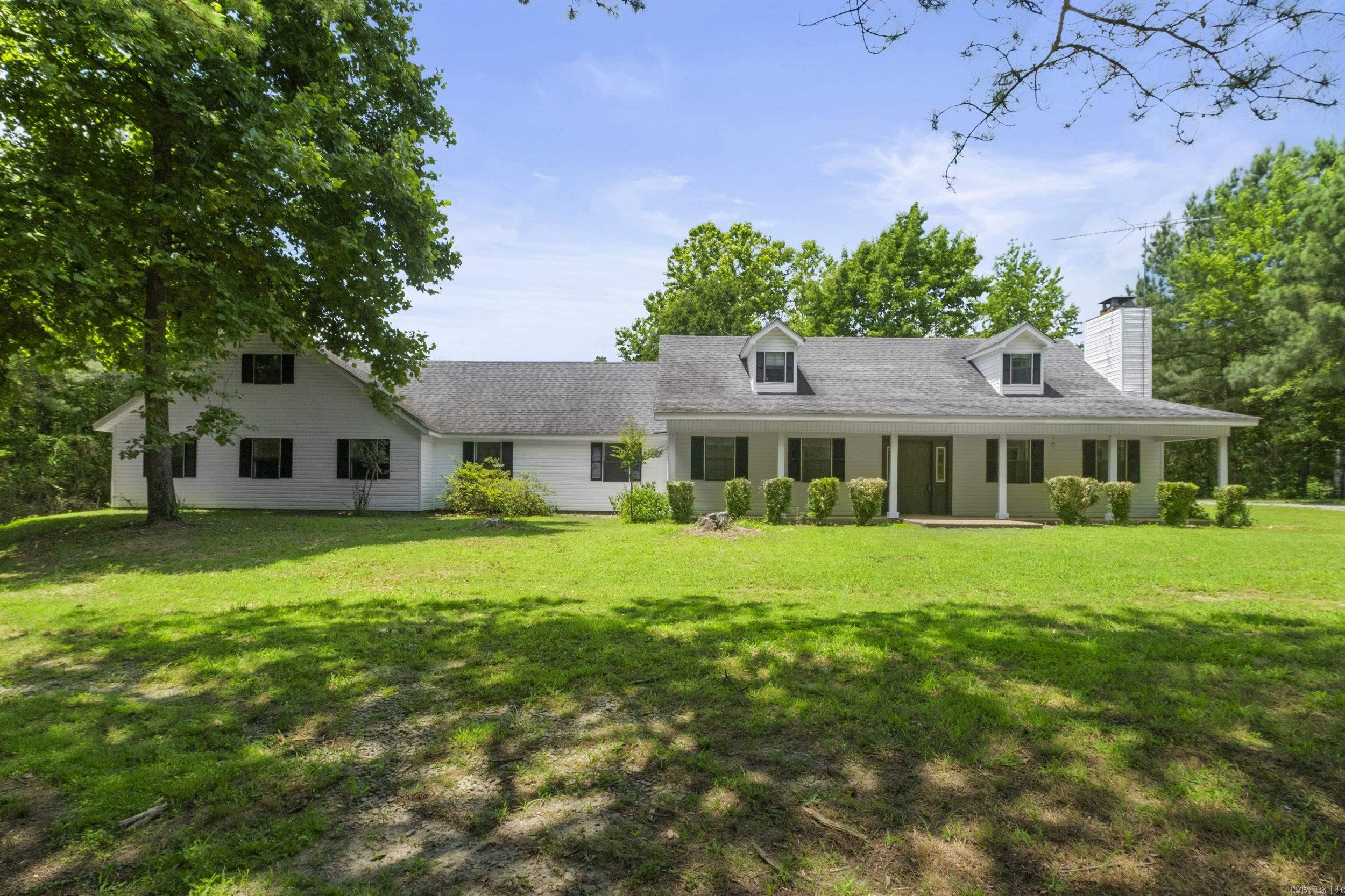Great opportunity in the heart of Rose Bud. 2 unrestricted private acres with 2,747 sq ft home. 3 Bed 2 Bath with lots of possibilities. 2 living areas, large bonus room and lots of storage. Office with outside entrance, could serve as an additional bedroom or living area. 3 car garage and outside storage buildings. Nice private lot with mature trees. Just across the street from the school. Walk to school and all the school functions. School also has a community safe room for bad weather conditions. Economically priced AS-IS. Home is ready to move in or make changes to make it your own.