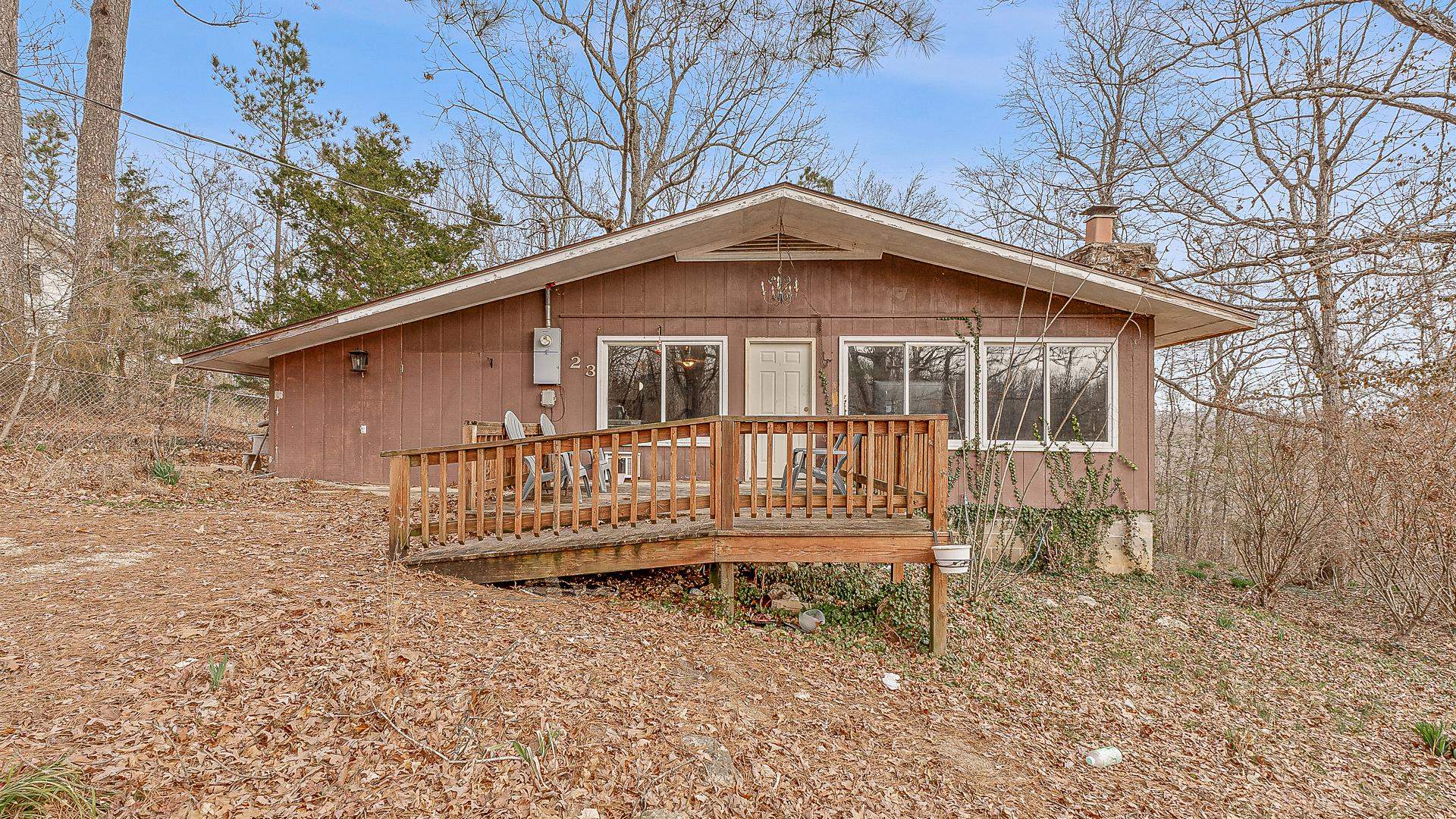 Tucked away in an Arkansas Ozark mountain lake community, this charming 2-bedroom, 1-bath home offers a cozy retreat with an additional bonus room and ample storage. It nestles into the wooded hillside while remaining conveniently close to the highway for easy access to local amenities. Large picture windows and a spacious front deck provide the perfect vantage point to enjoy stunning country views and seasonal wildlife year-round. Best of all, a great fishing spot at Spring Lake is just a short walk away! Plus, you're only two miles from the beautiful private Lake Vagabond, complete with a marina, beach, and playground. Located just 7 miles from Spring River attractions and about an hour from Jonesboro, this property offers the perfect balance of seclusion and convenience. High-speed fiber optic internet is available!