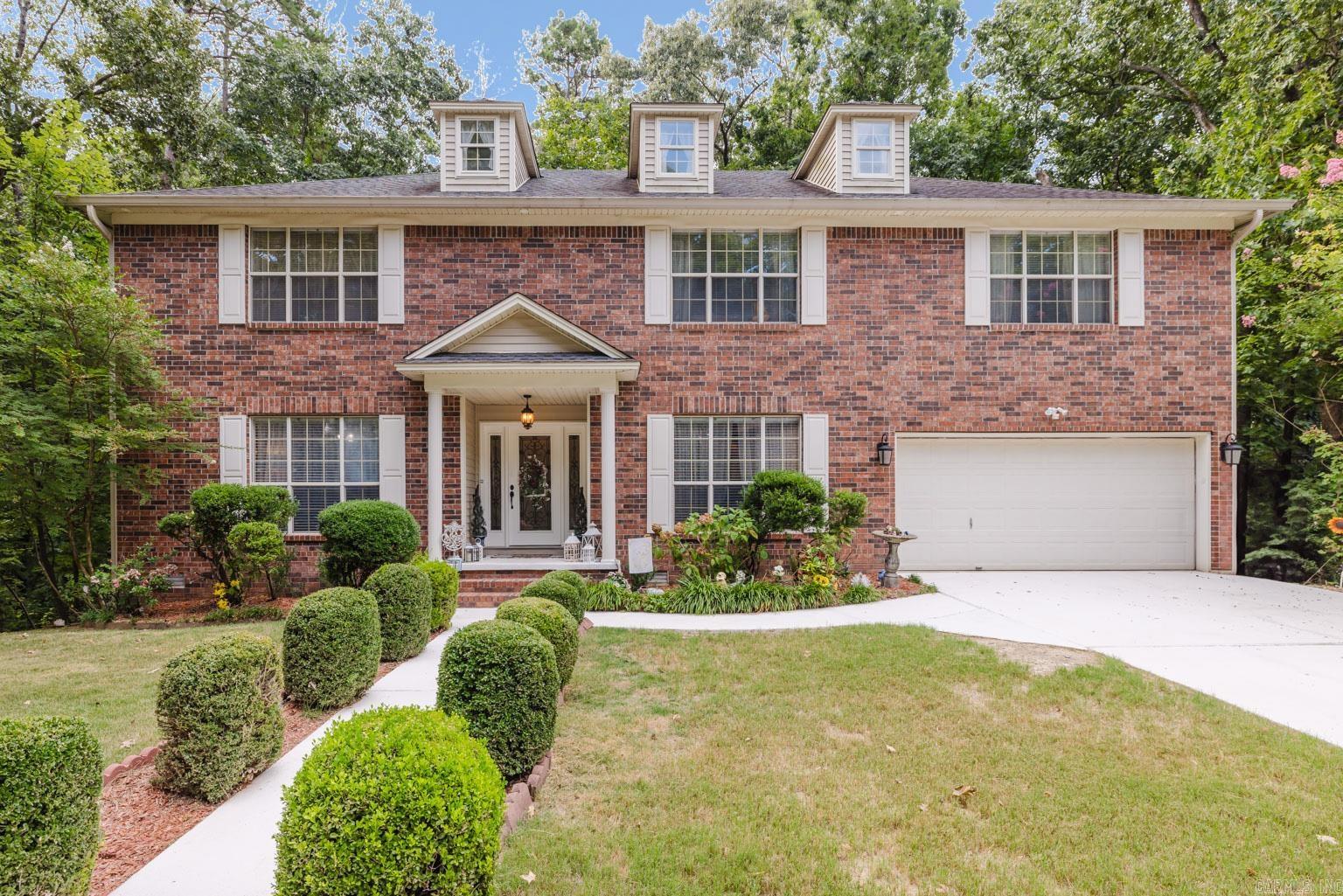 GORGEOUS home in the established River Oaks subdivision! This home has all the space and privacy you have been looking for at just the right price! Large living room with laminate flooring, gas log fireplace and dry bar. Eat in kitchen with Granite countertops, breakfast bar PLUS separate dining room. HUGE laundry room/pantry. HUGE master suite with walk in closet, walk in shower and double vanities. 3 nice sized spare rooms with bonus living/play area upstairs. PEACEFUL 2 tiered covered back porch overlooking backyard that is fully fenced and backs up to the woods. 2 car garage PLUS 1 car garage with its own driveway that goes into the basement (basement is also accessible from inside the home)! Exterior of the home has eve lights and is a dream to come home to! Imagine all the possibilities and make this home yours today!