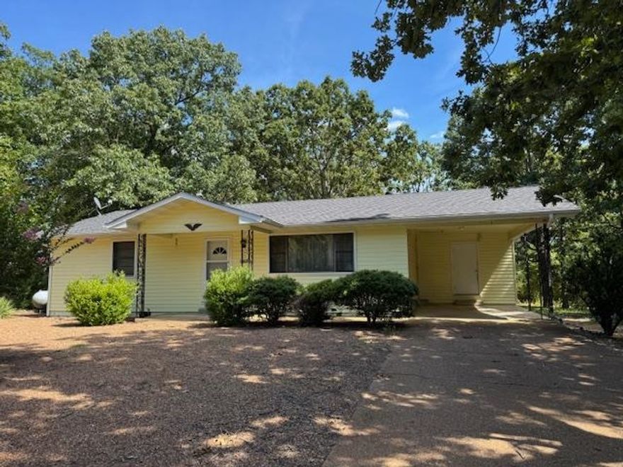 Charming 2-Bedroom, 2-Bath Oasis in Horseshoe Bend with Recent Updates!  Discover comfortable living in this delightful 2-bedroom, 2-bathroom home, perfectly situated on a generous 0.38-acre (more or less) level lot in the heart of Horseshoe Bend, Arkansas. This inviting residence boasts a serene setting with an abundance of beautiful trees and vibrant flowers, creating your own private sanctuary. Step inside and feel the warmth of the newly installed gas log fireplace, perfect for cozy evenings. Enjoy the fresh air with a new front screen door and stay comfortable year- round with a new heat pump installed in June 2021. Essential updates also include a new electric water heater (June 2018) and a new roof (May 2020), adding to the home's value and efficiency. The spacious lot offers plenty of outdoor potential, including a 10x14 storage shed for all your tools and toys. For those with a green thumb or a love for aquatic life, the existing pond would make a fantastic koi pond. This move-in-ready home comes complete with all appliances, making your transition seamless. Most of the furniture will stay, with only a few select pieces excluded, allowing you to settle in immediately!