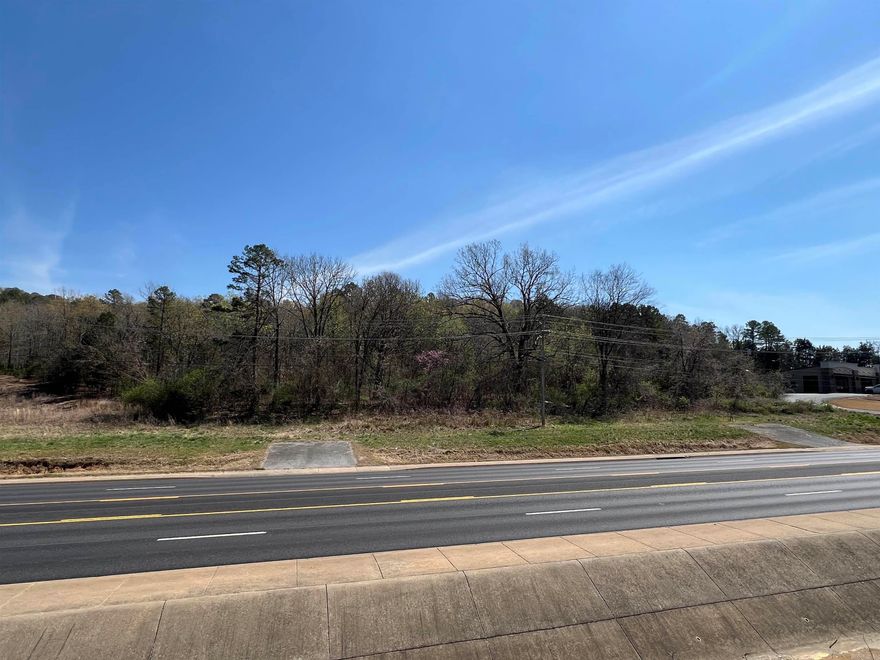 Prime vacant commercial land in Batesville, AR, ideally situated near major shopping locations and Eagle Mountain.  This site offers approximately 230 feet of frontage on Harrison Street, making it an attractive opportunity for development.  Perfect for restaurants, retail, and other commercial ventures, this land provides excellent visibility and accessibility.  Its strategic location ensures traffic and visibility, making it an ideal spot for businesses looking to thrive in a bustling area.