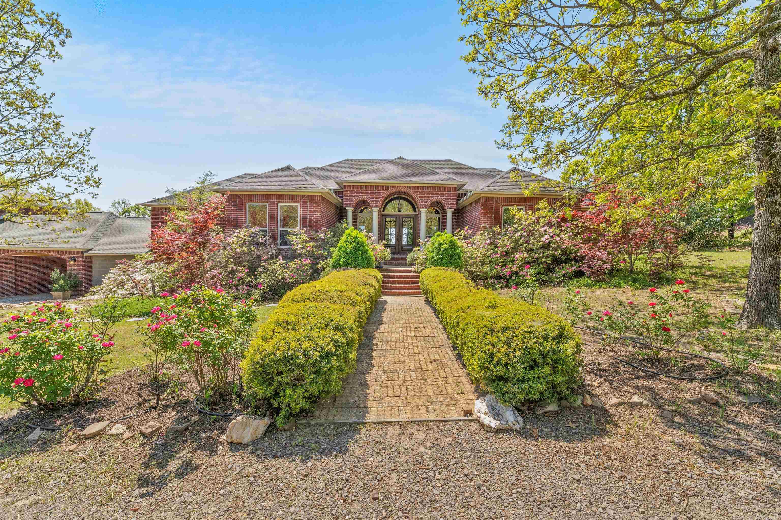 Welcome to your Private Bluff Retreat in Faulkner County! Nestled on 3.07 acres with sweeping viewsof the Arkansas River and unmatched privacy, this peaceful estate is a rare find. The main home (3,117 SF, built 2009) features 3 bedrooms, 2.5 baths, a spacious primary suite, and an inviting kitchen with built-in refrigerator, double oven, and under-cabinet lighting. Step out onto the new 2023 deck—complete with storage and ambient lighting—and soak in the natural surroundings. A detached two-story guest house (2,410 SF, ~2020) offers flexibility for multi-generational living or extended guests with 2 bedrooms, 2 baths, a sunroom with stunning views, bonus room, full kitchen, and garage. Modern comforts include a new whole-house water filtration system (2025), storm shelter, generator hookup, high-speed buried fiber internet, and a $65,000 solar system (to be paid off at closing). Septic tank pumped in 2024. Extras that convey: hot tub, concrete raised beds, solar panels, and two Ring doorbells. Exclusions: exterior cameras, silver metal garden beds, and freestanding generator. A true sanctuary—where privacy, nature, and everyday comfort meet.
