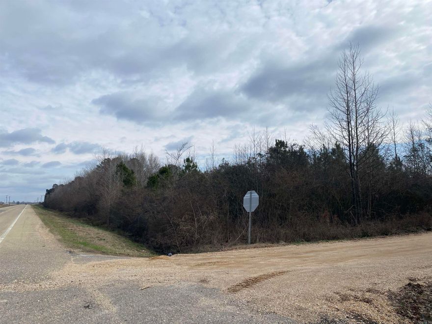 7.921 Acres located across from Crossett Municipal Airport at the corner of Ashley 413 and Hwy 52W.  Survey in file.