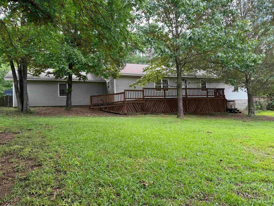 3 bedroom, 2 bath, 1,792 sq ft home sitting on 3 lots in the Higden area. Home has concrete drive going into the 2 car garage. Property has a fenced back yard, storm shelter and a 12 x 16 storage shed. Kitchen has tile floor, eat in bar, and black appliances. Nice size living room with outside access to the covered patio area. Home also has a large laundry room and an extra room that can be used as a 4th bedroom or an office. Close to Greers Ferry Lake with boat launch just down the road. This one is a must see.